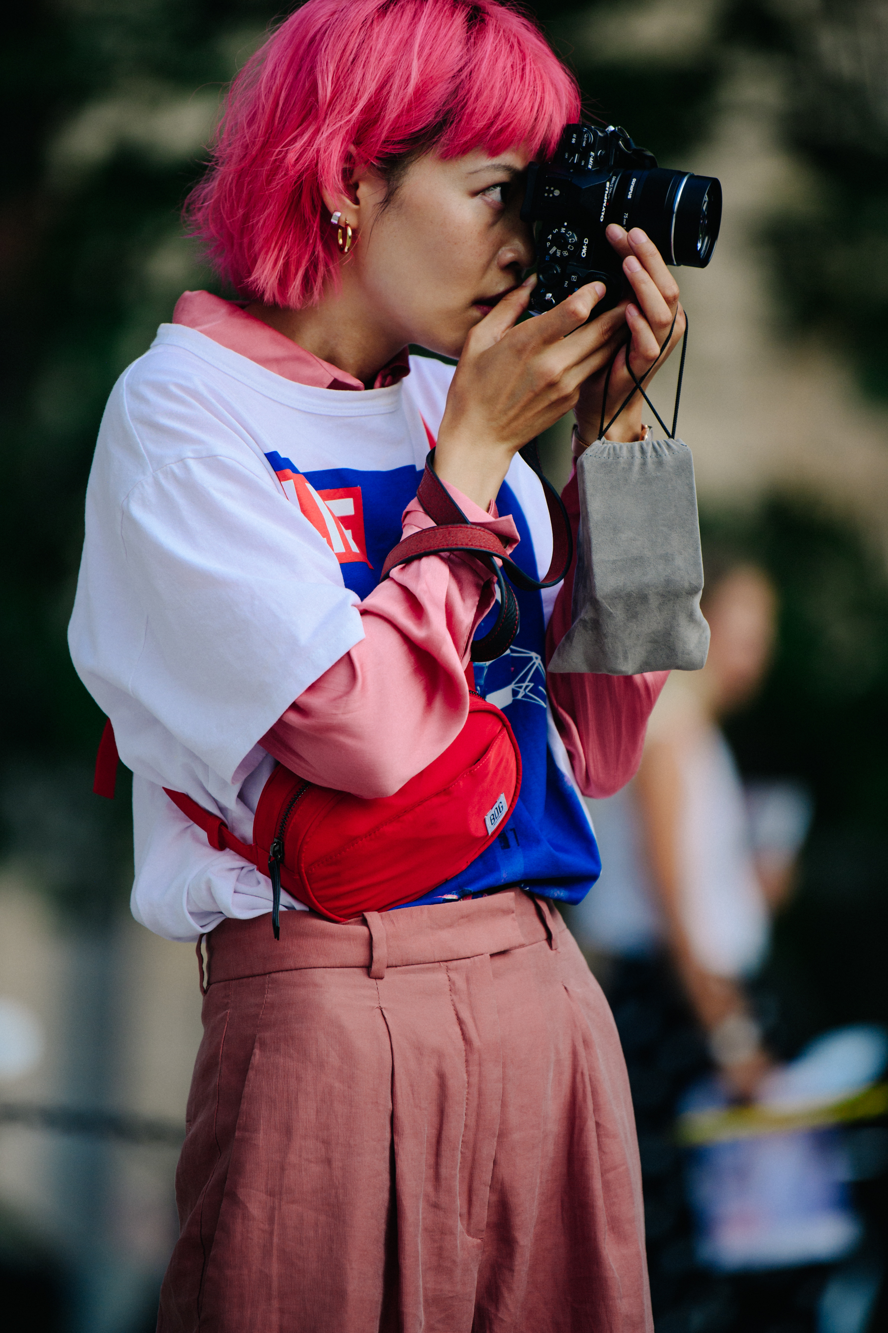 Asian woman with pink hair