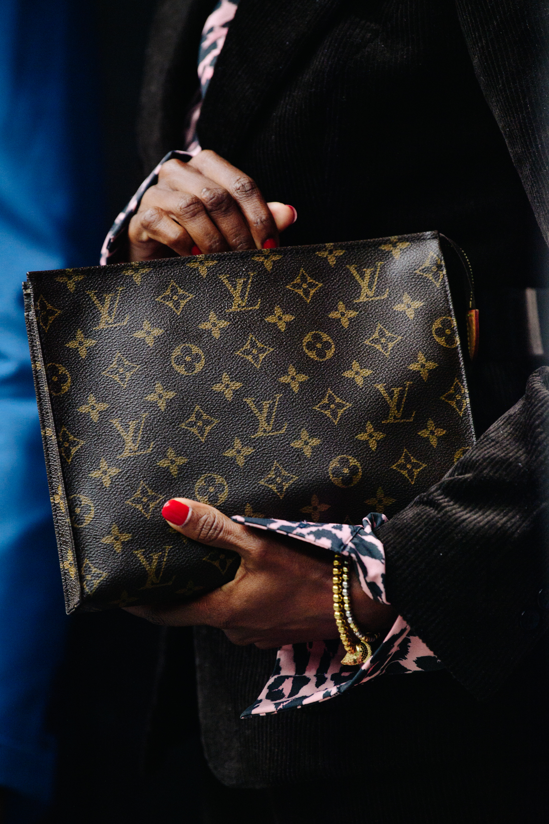Woman carrying Louis Vuitton bag