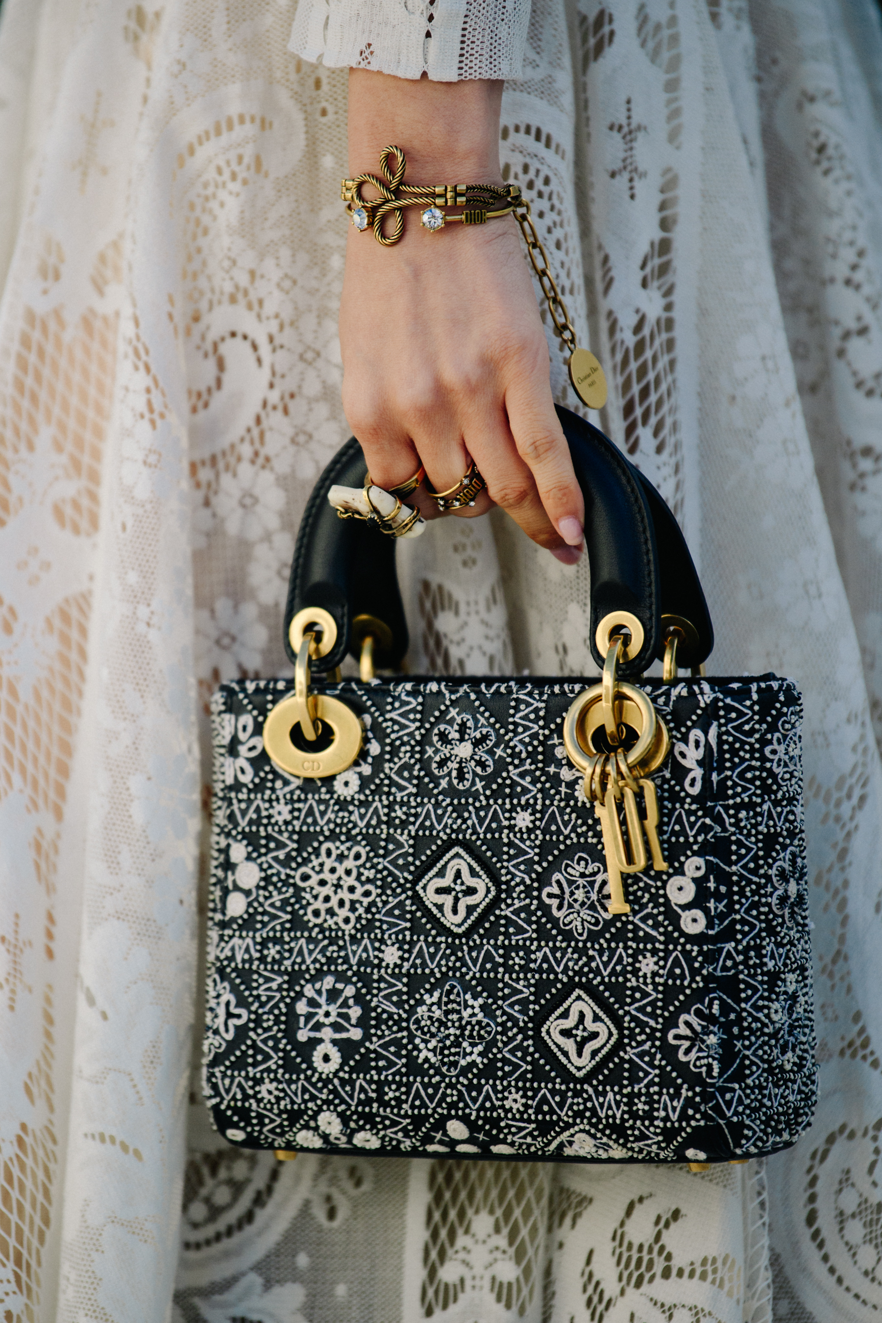 Woman carrying Christian Dior bag