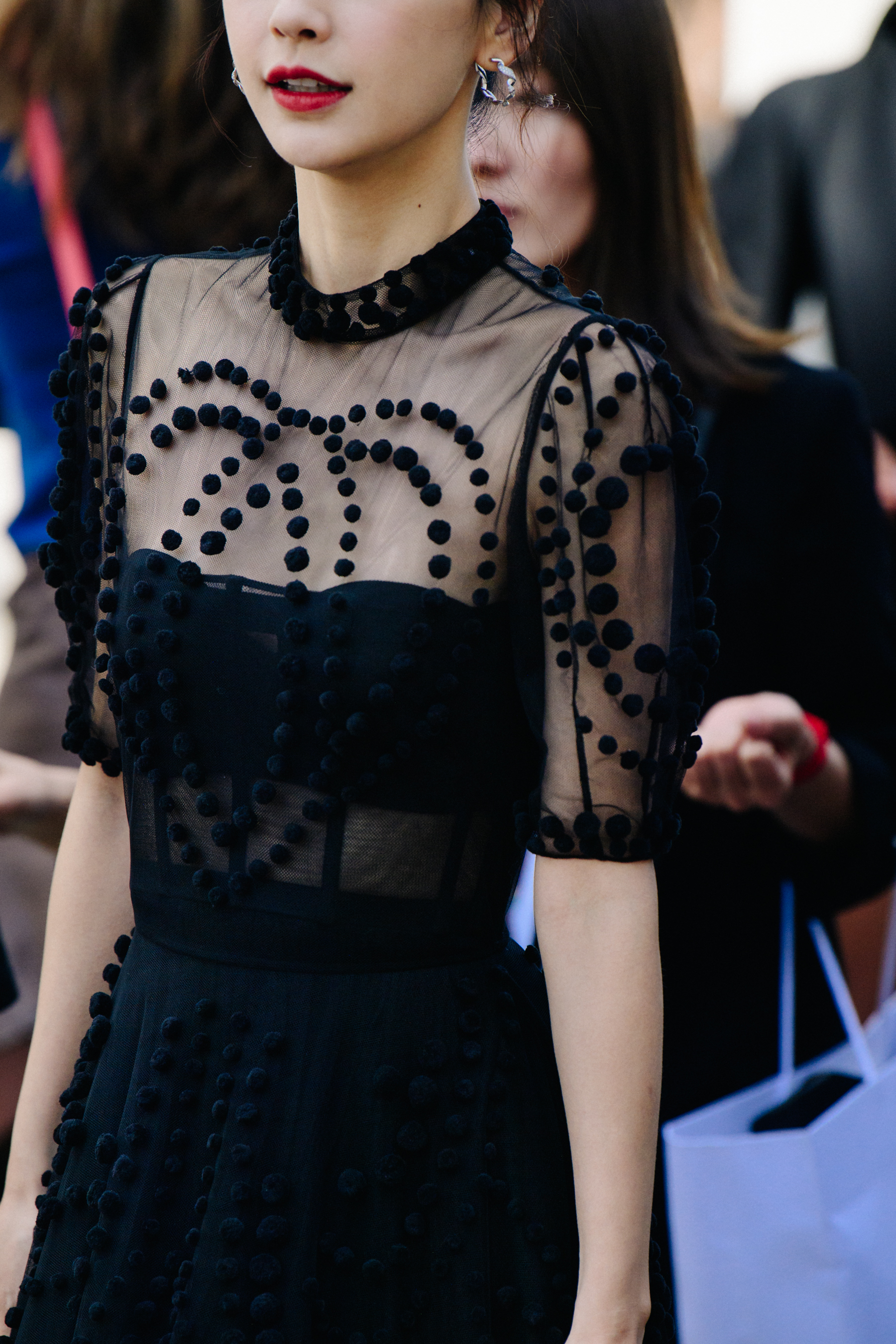 Asian woman wearing black lace dress