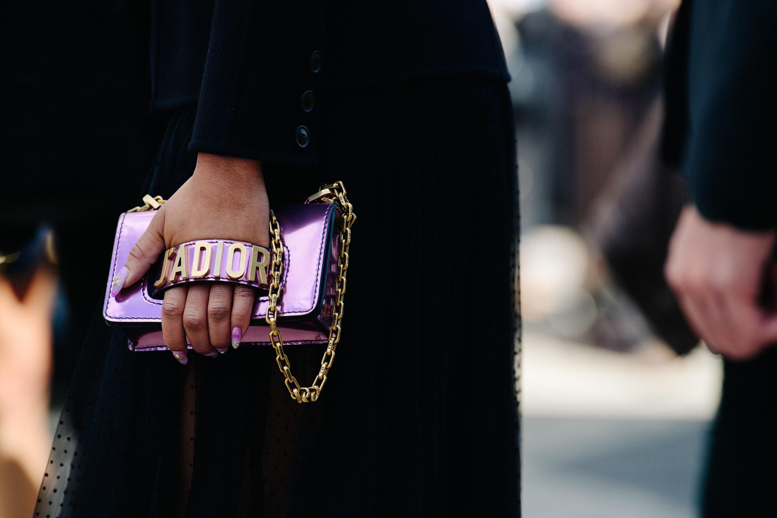 Woman carrying Christian Dior bag
