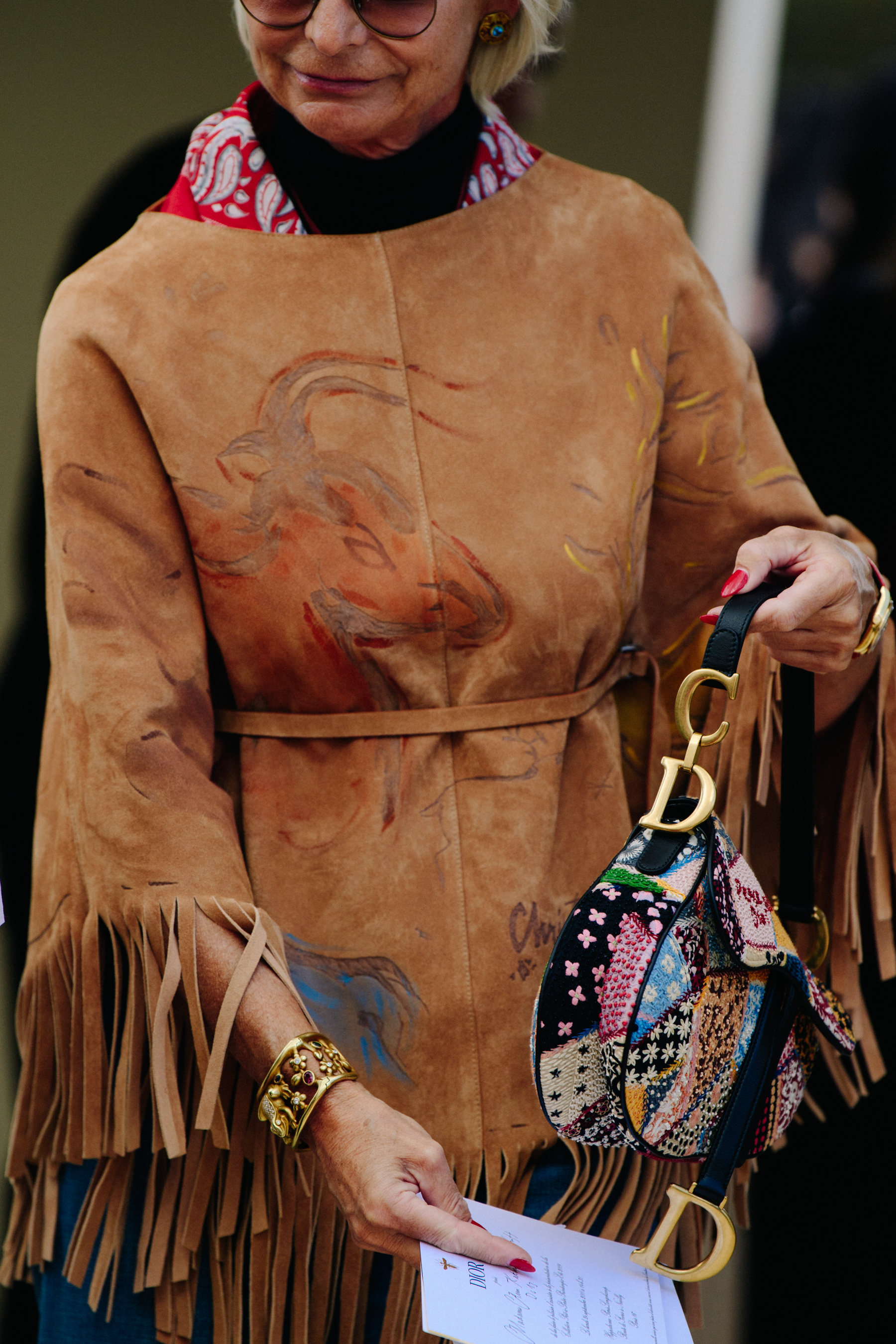Woman carrying Christian Dior bag