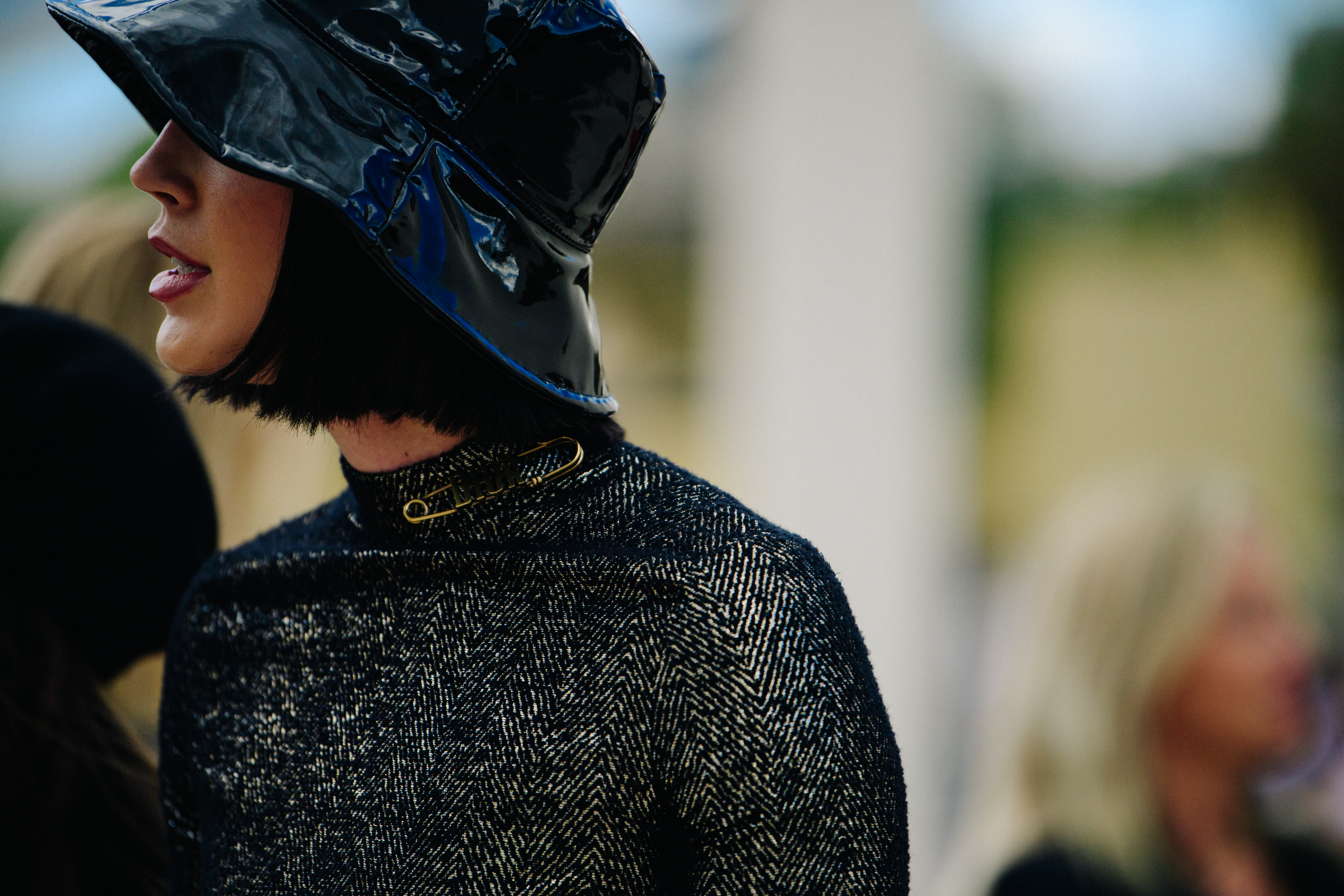 Woman wearing Christian Dior pin