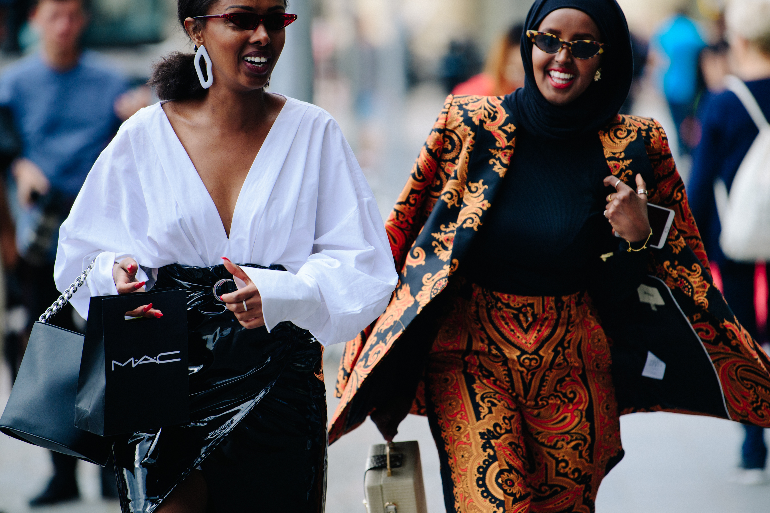Two women wearing stylish sunglasses