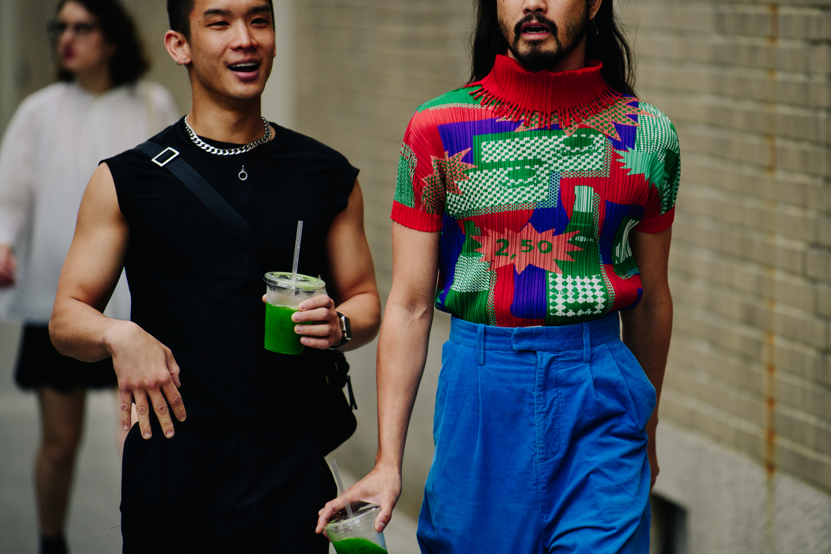Two men wearing fashionable tops