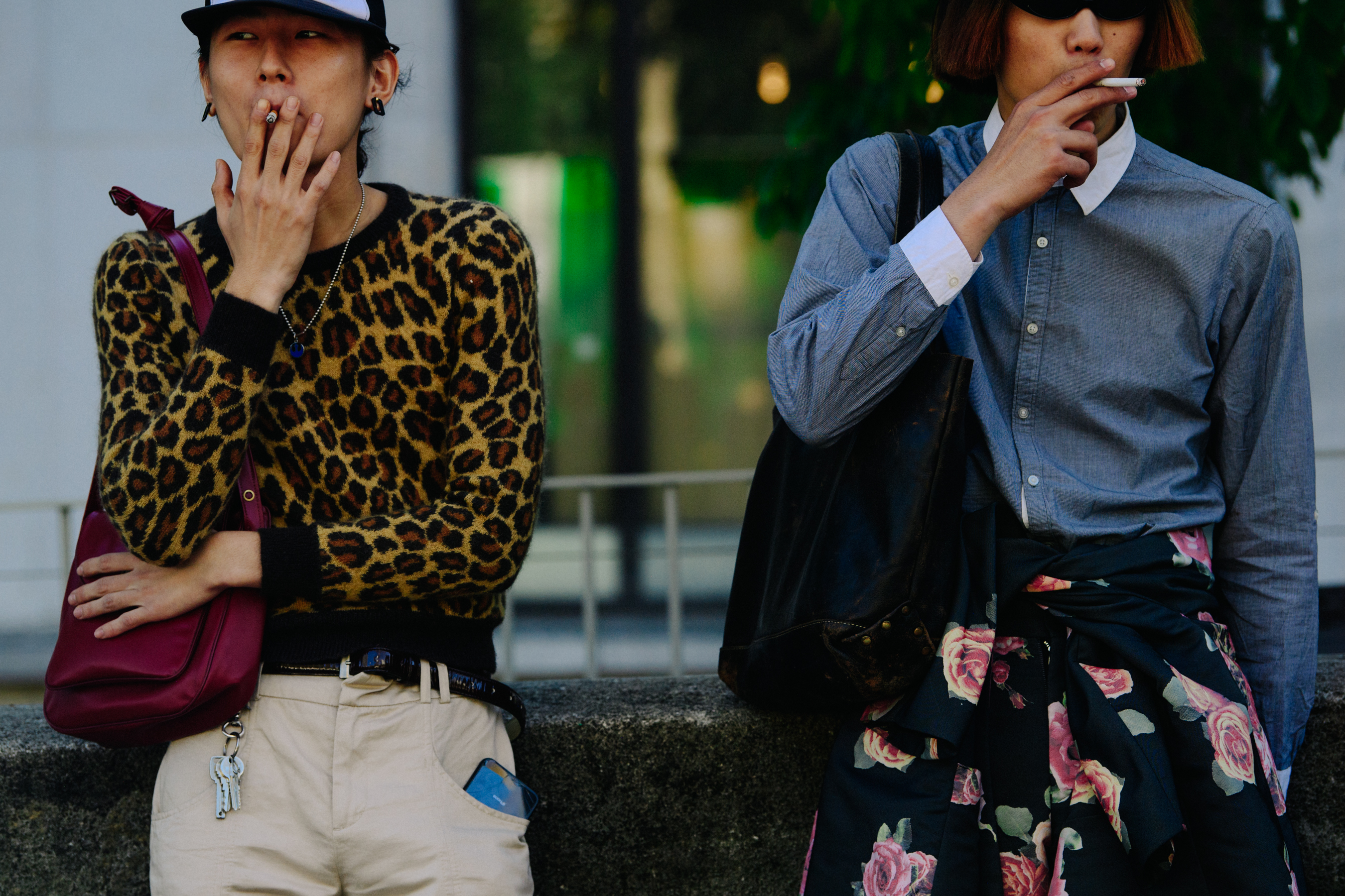 Asian men smoking at fashion show