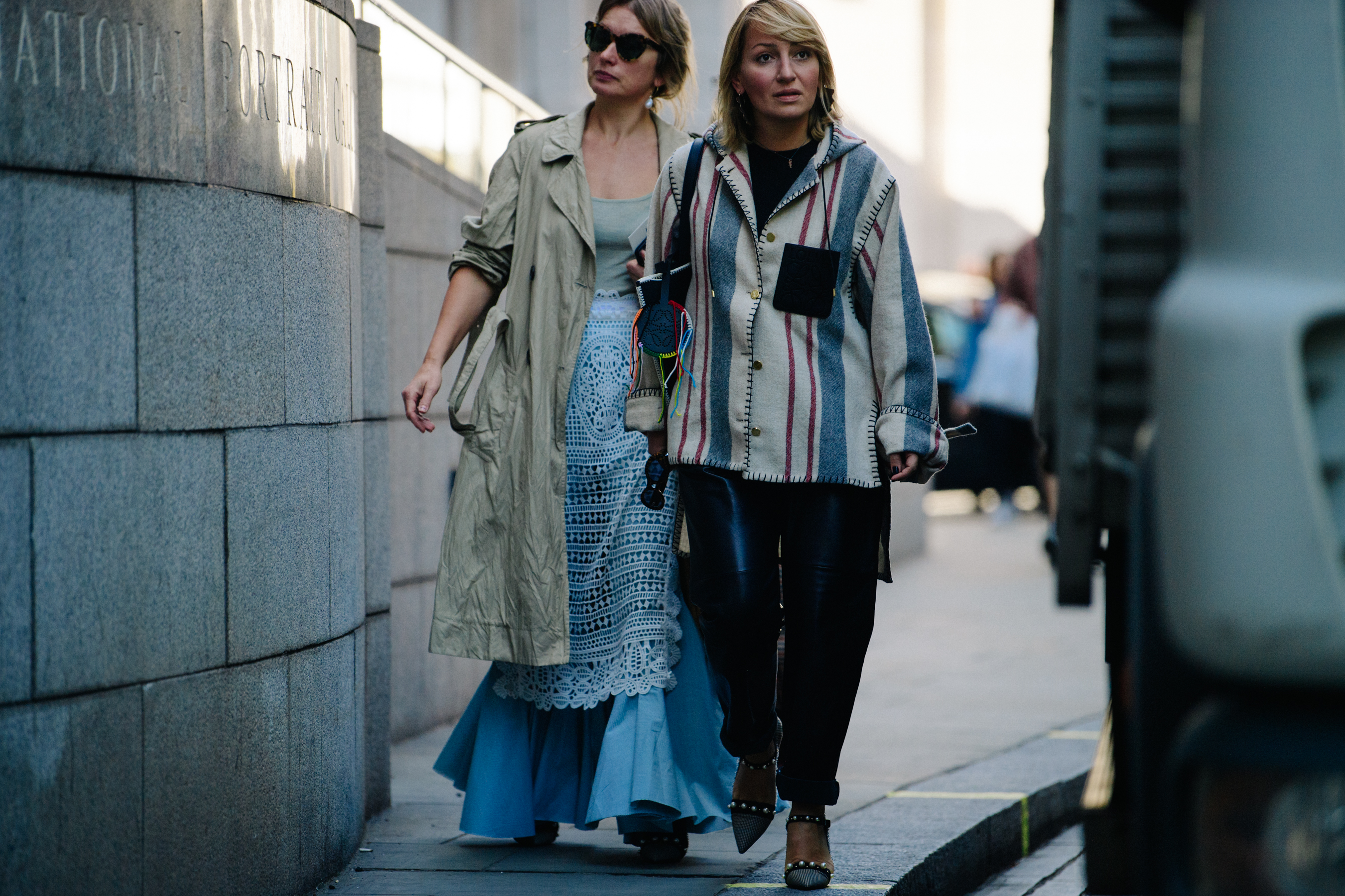 Two women wearing light outfits