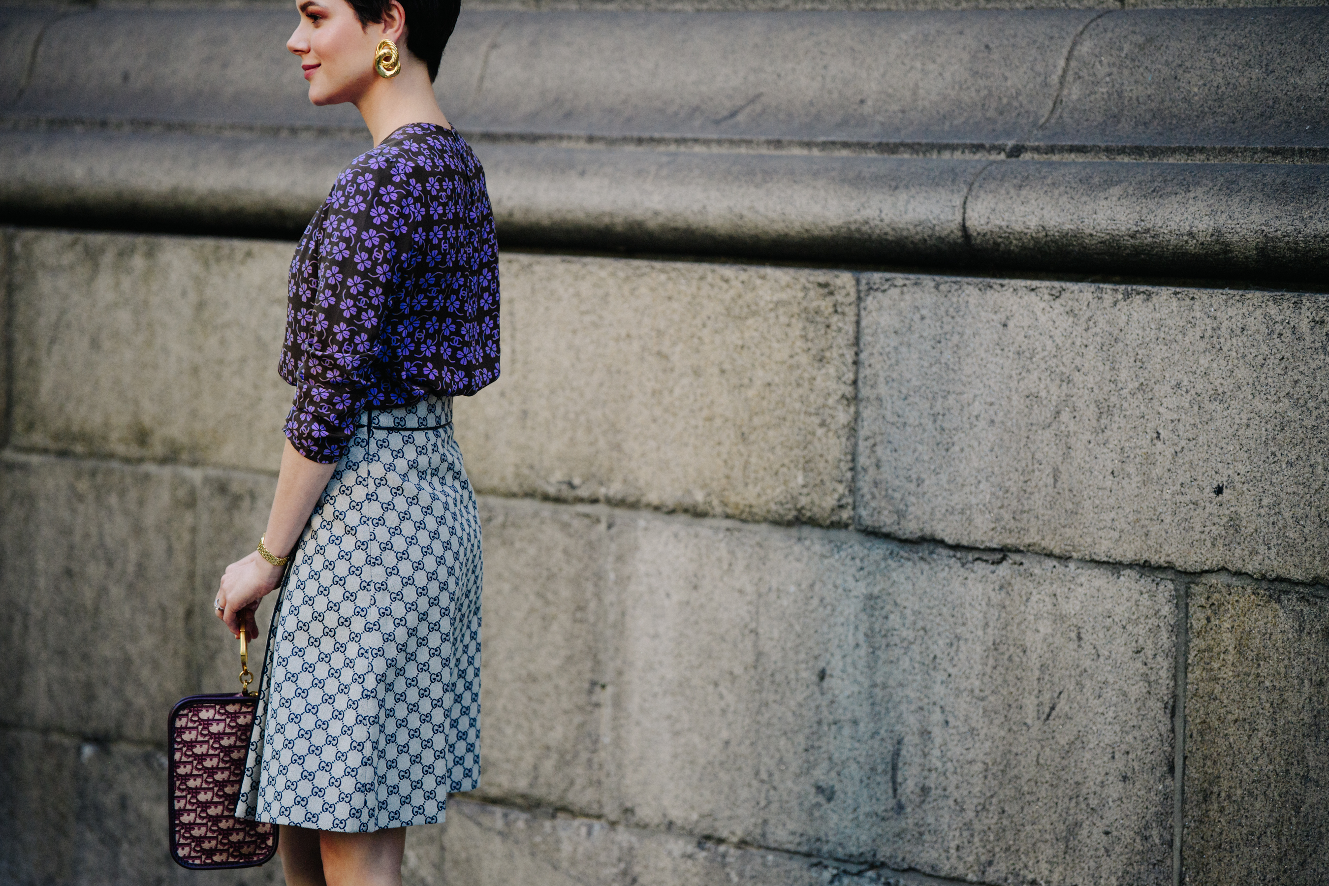 Woman wearing purple floral shirt