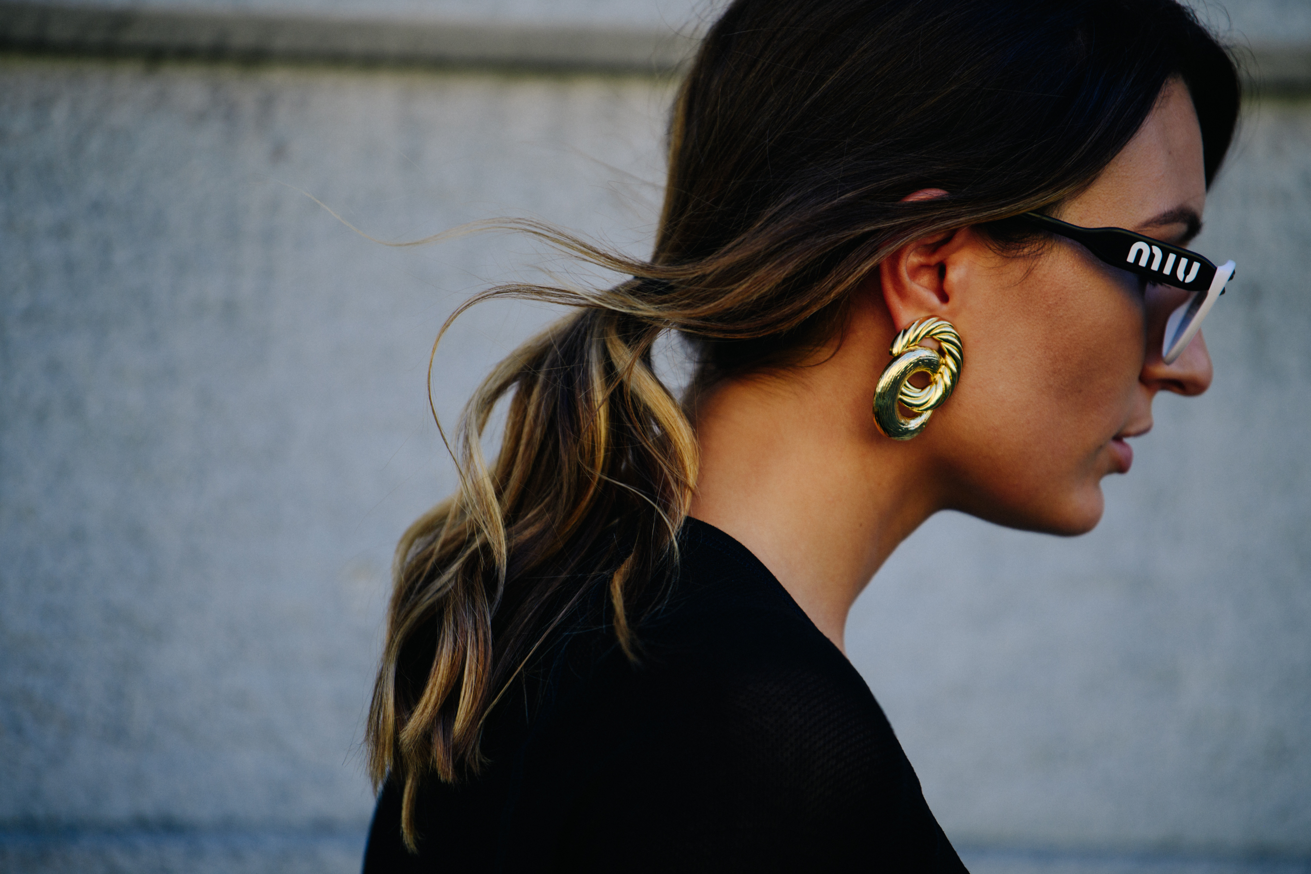 Woman wearing Miu Miu glasses