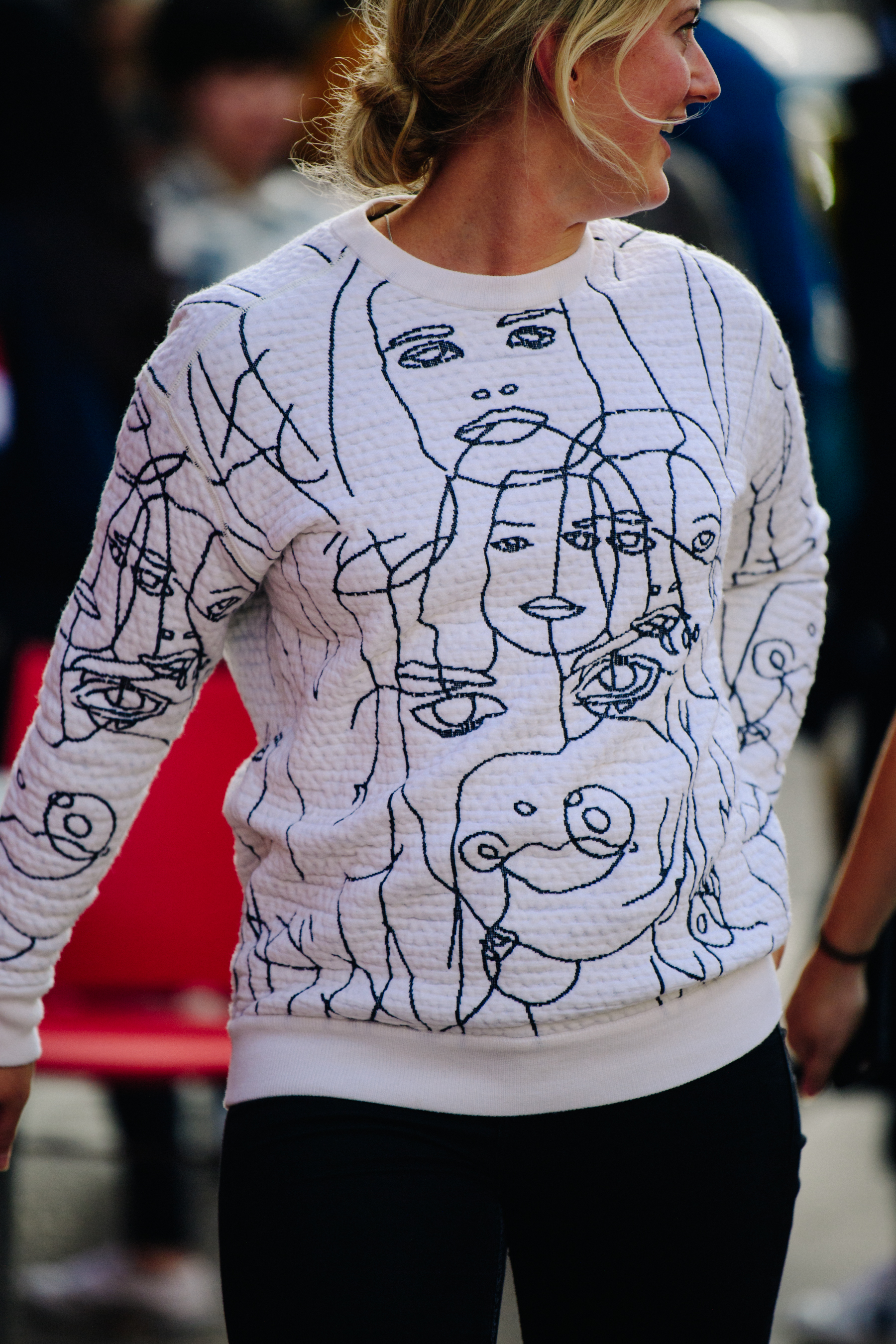Woman wearing white jumper