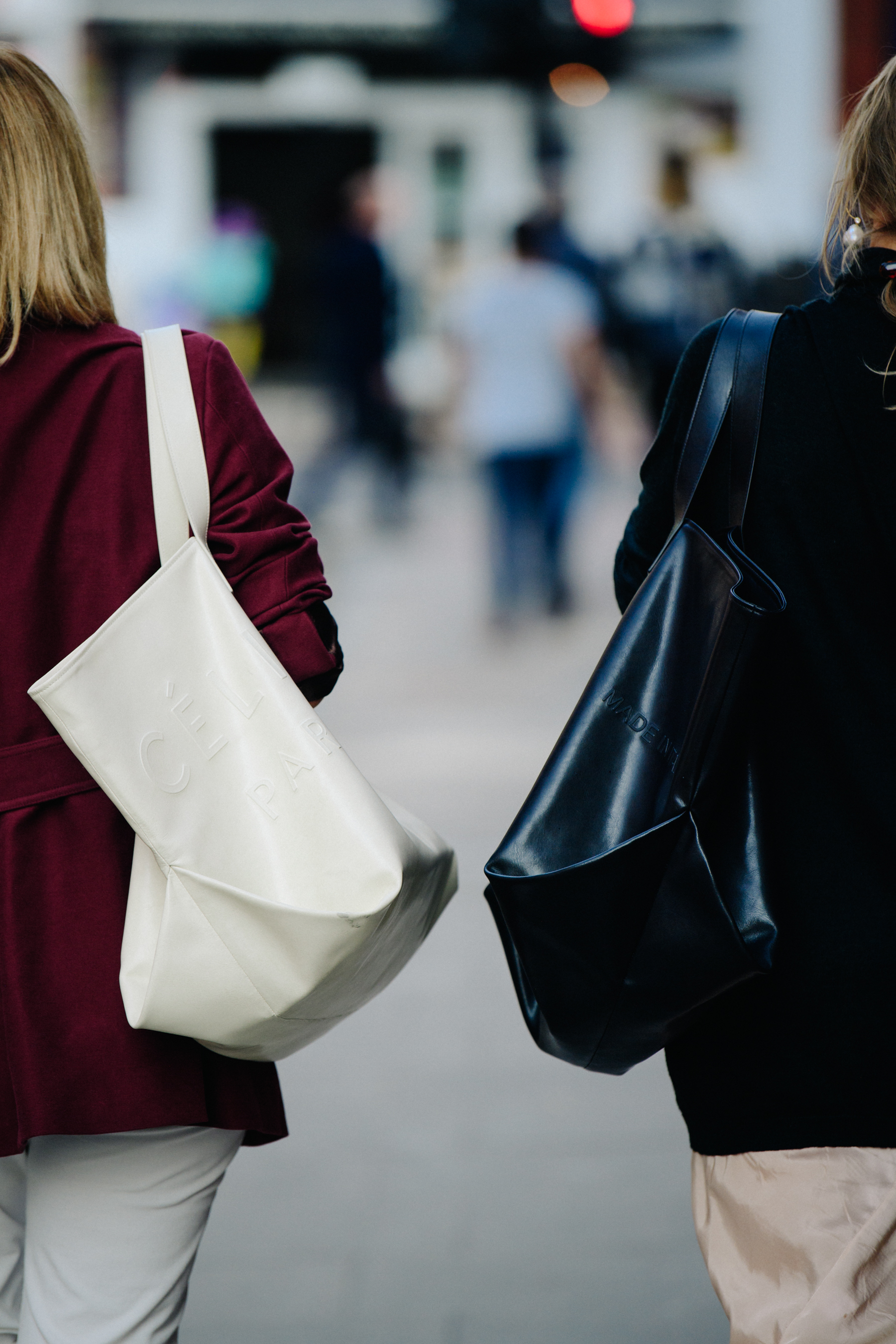 Two women carrying Celine bags