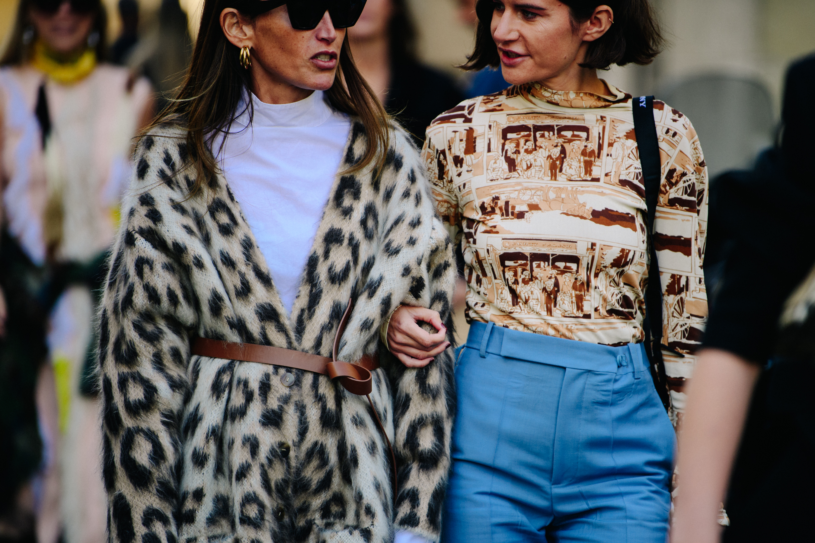 Two women wearing pattern tops