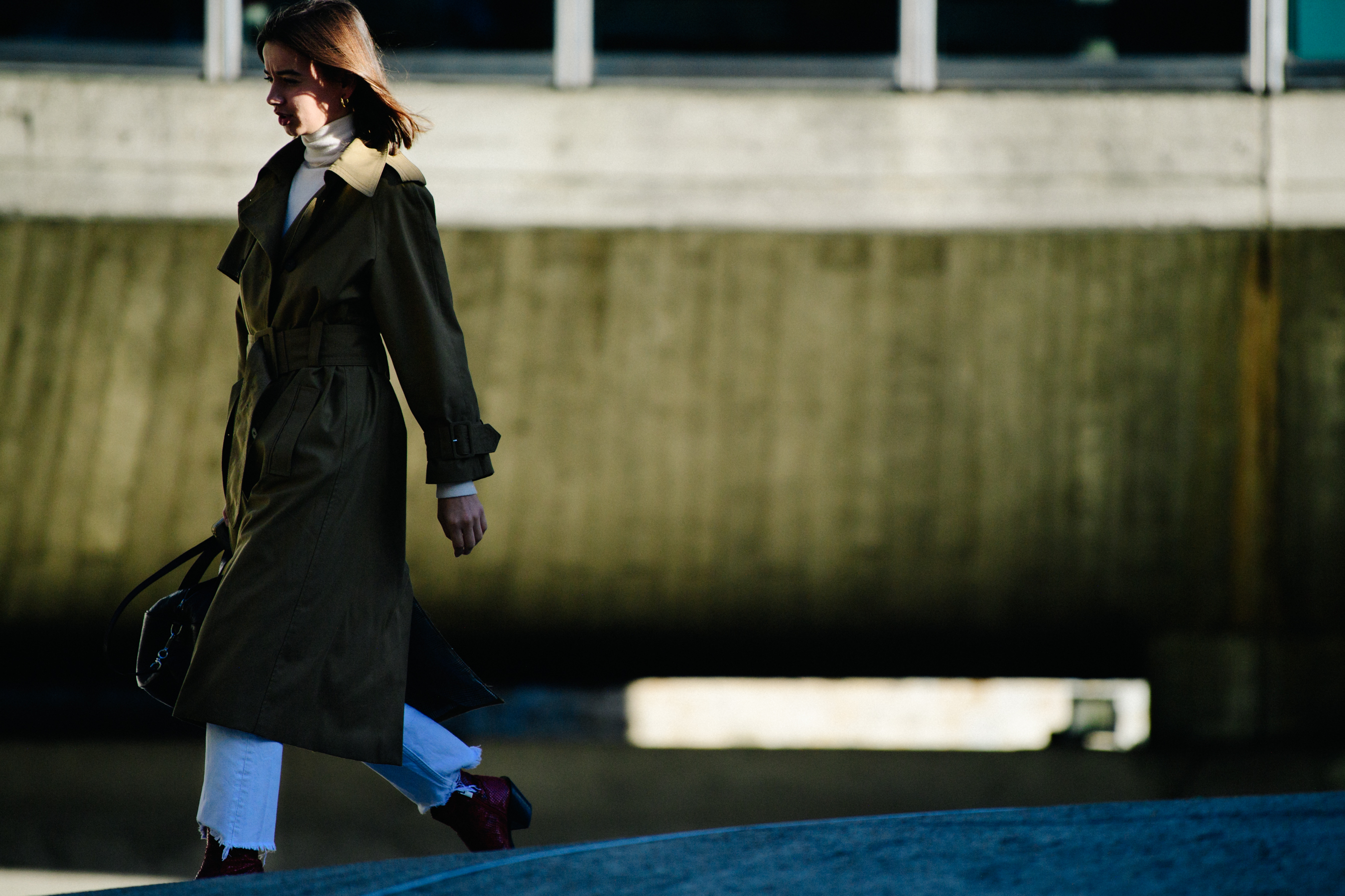 Woman wearing long green coat