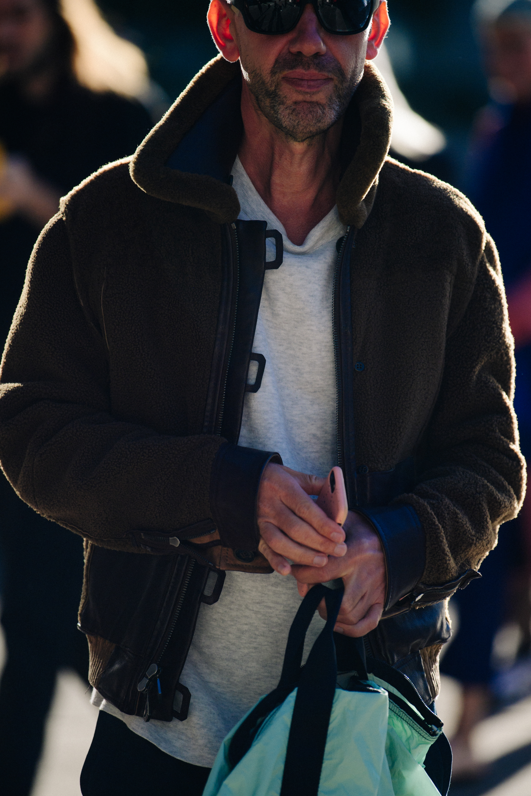 Man wearing brown shearling jacket