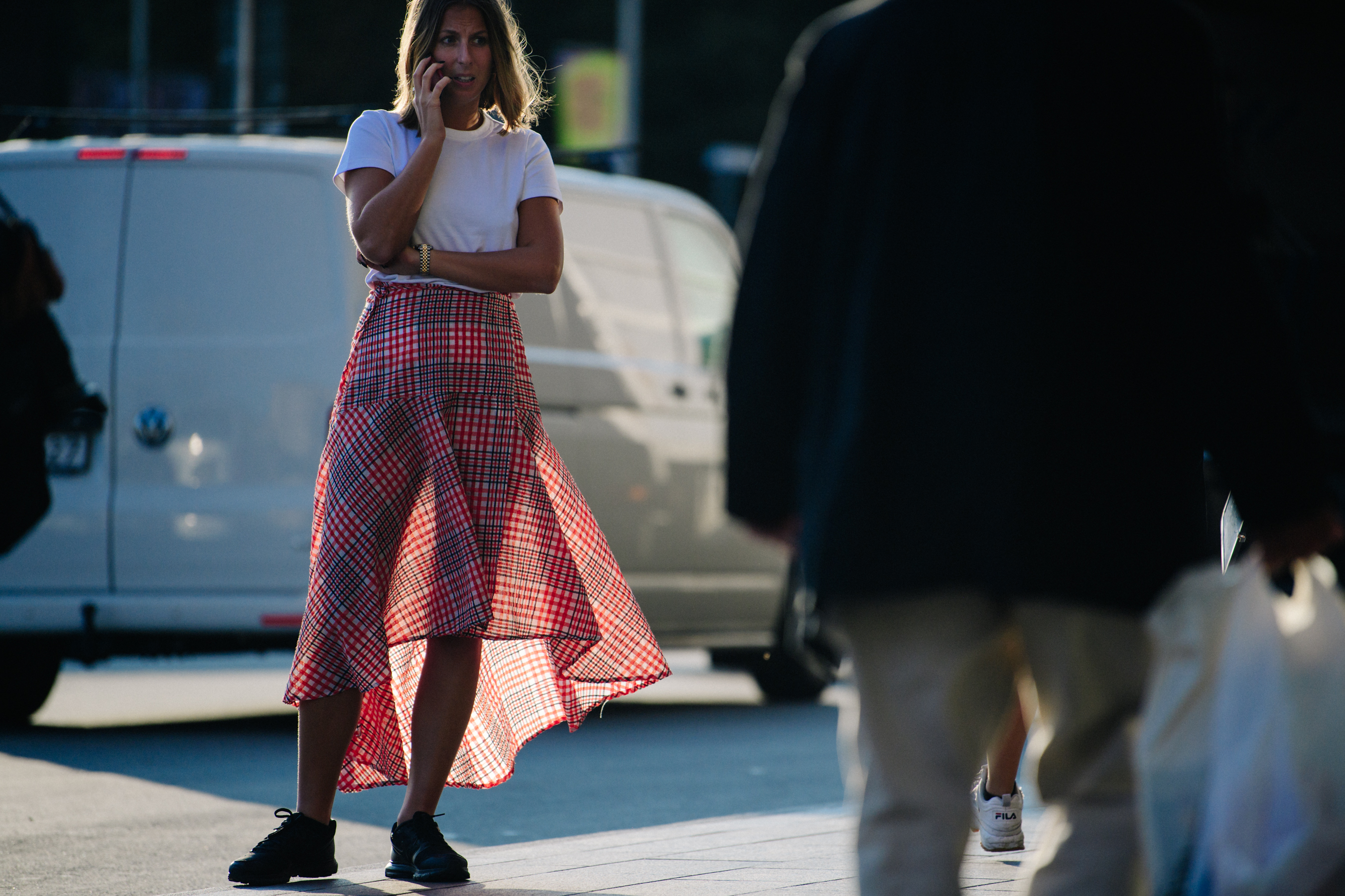 Woman wearing red check skirt