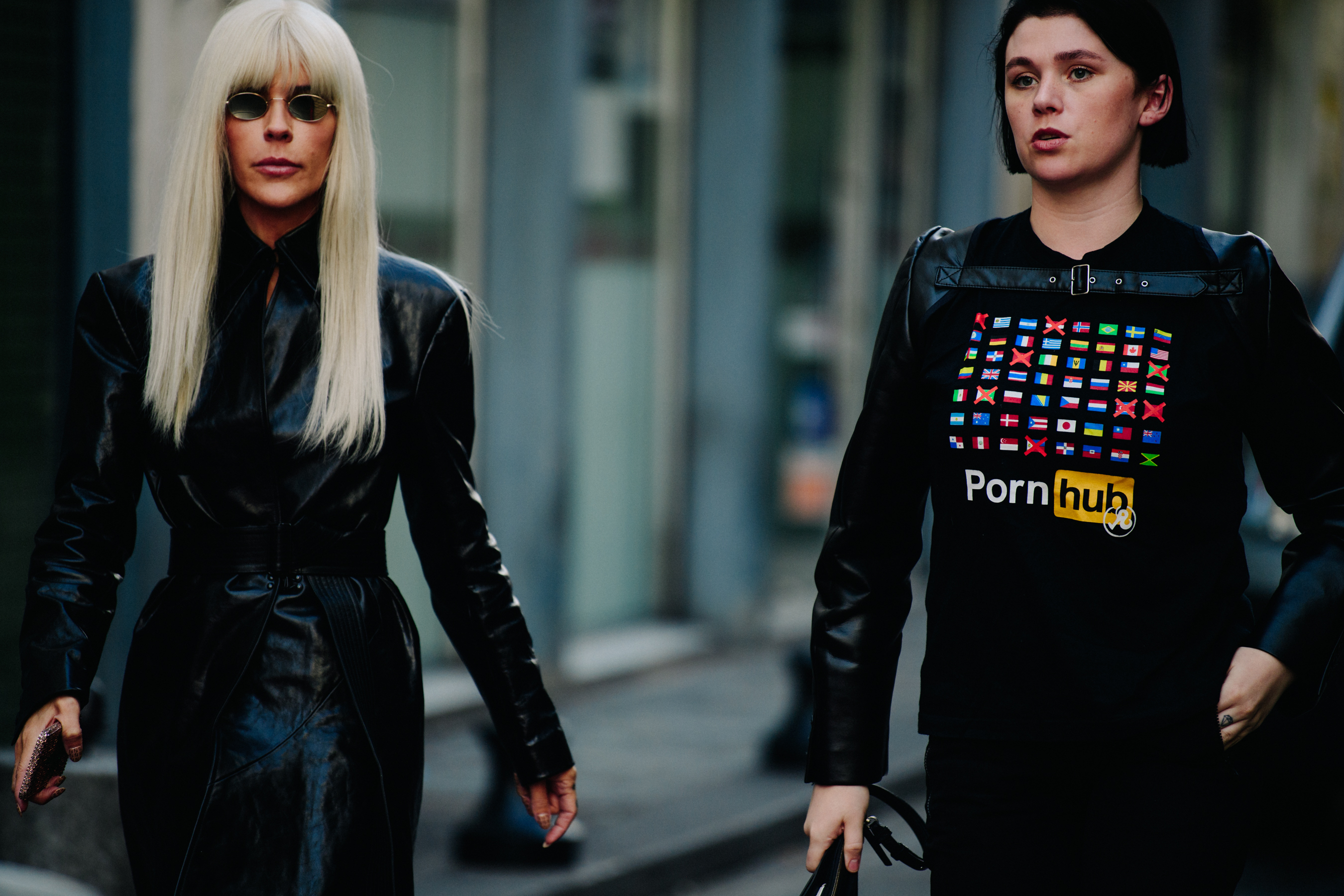 Two women wearing black tops