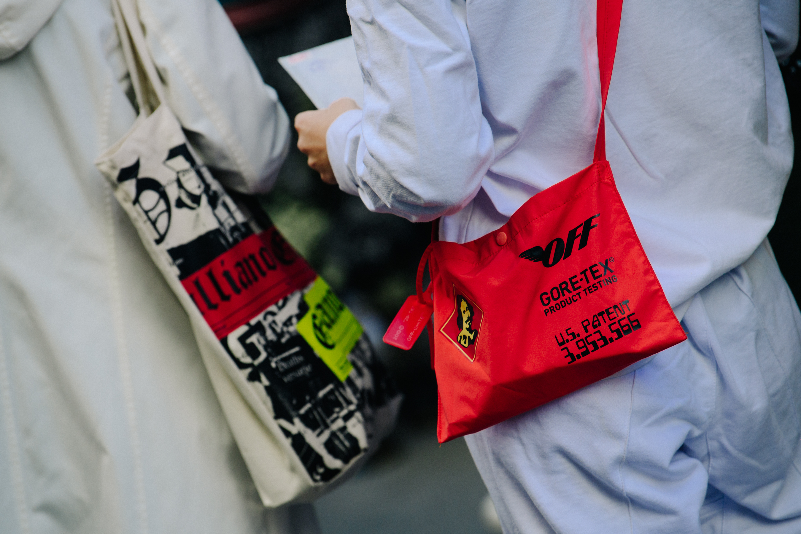 Man carrying red Off-White Gore-Tex bag