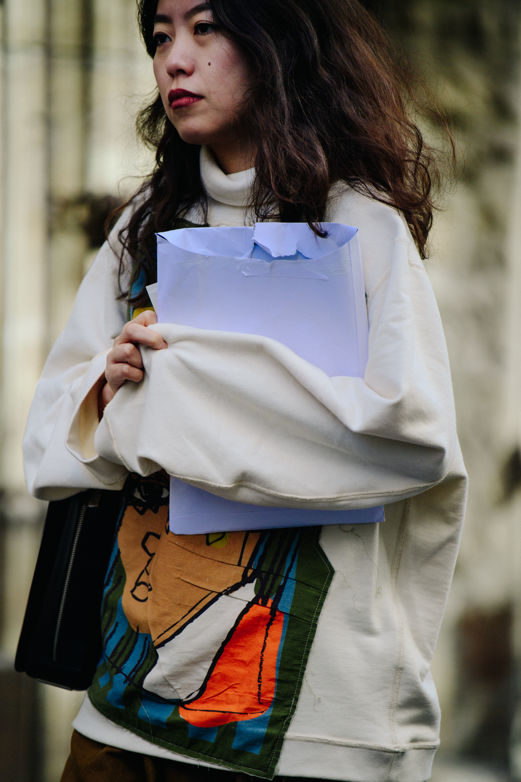 Woman wearing white pattern jumper