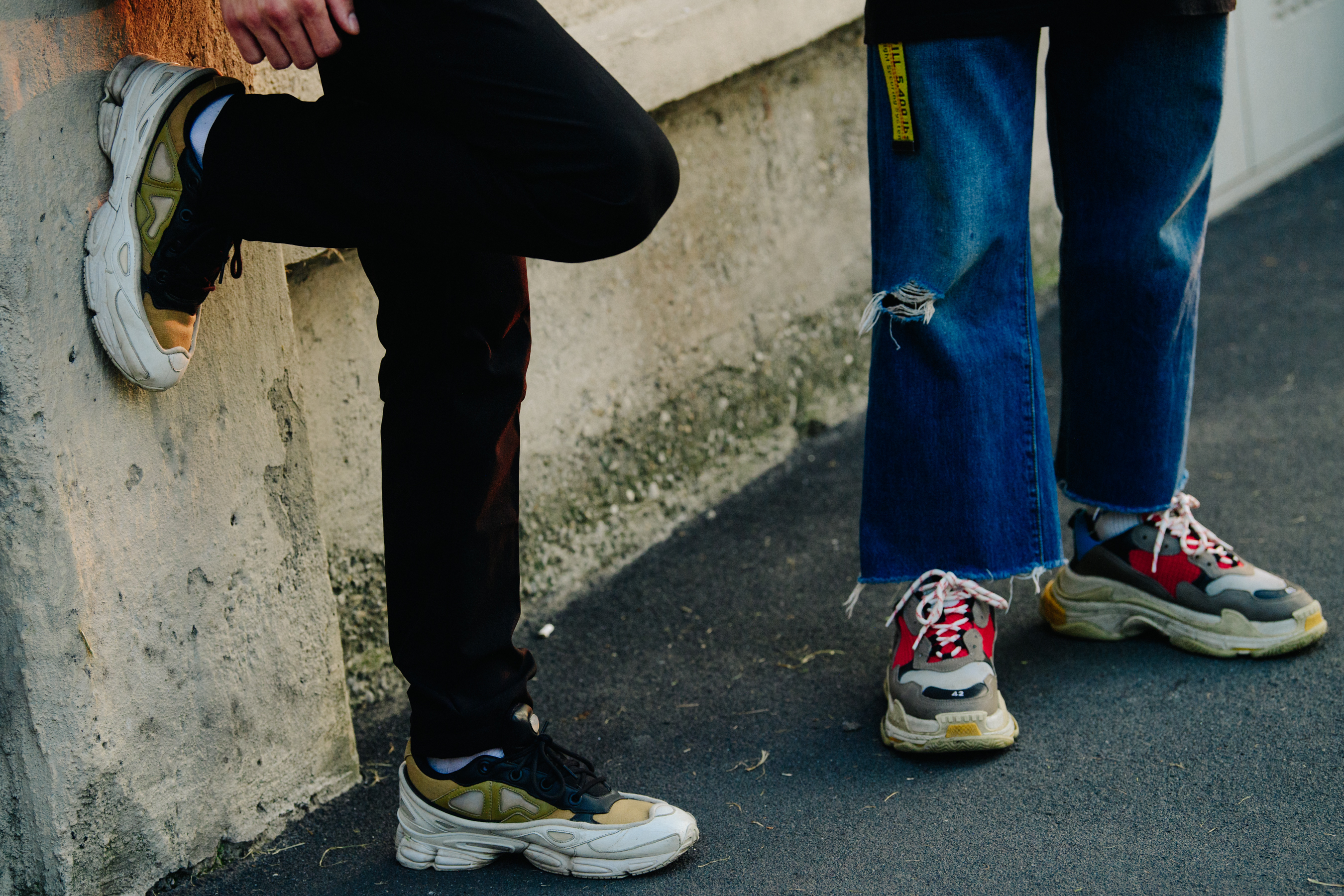 Two men wearing designer shoes