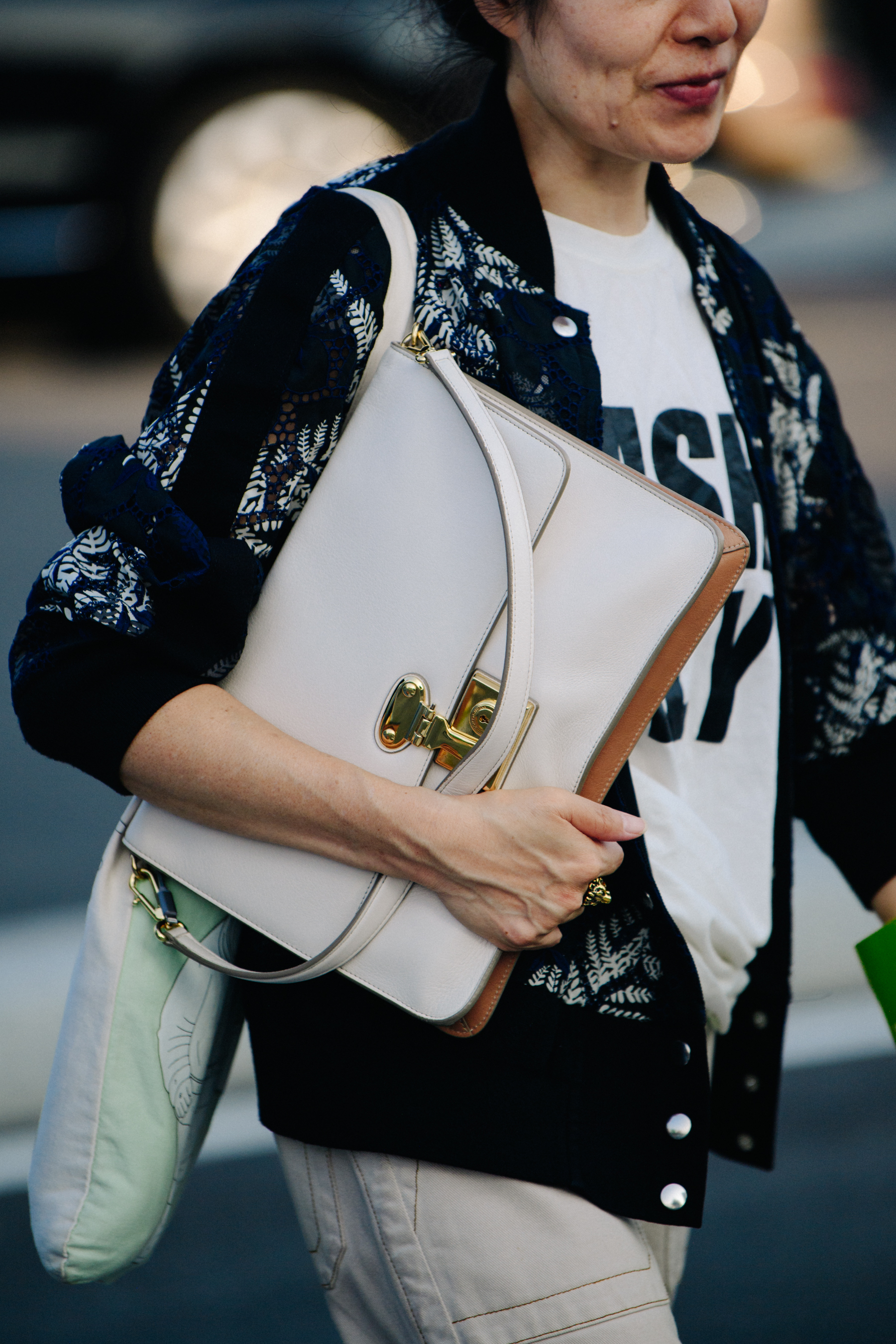 Woman carrying white bag
