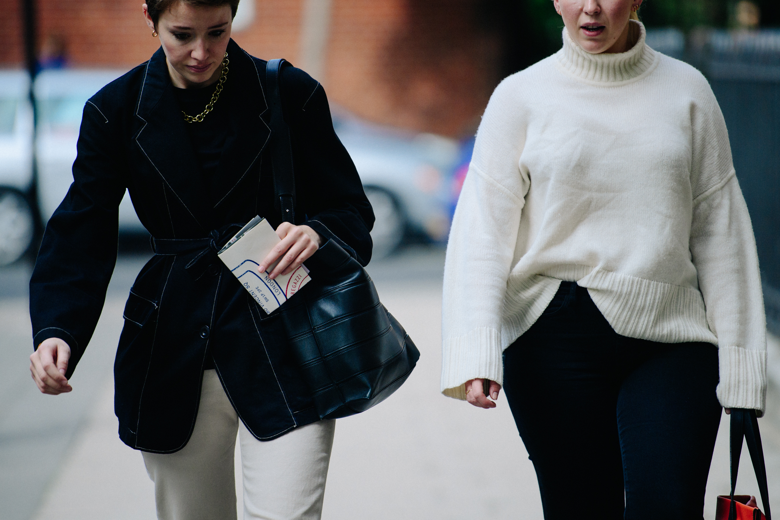 Two women wearing black and white
