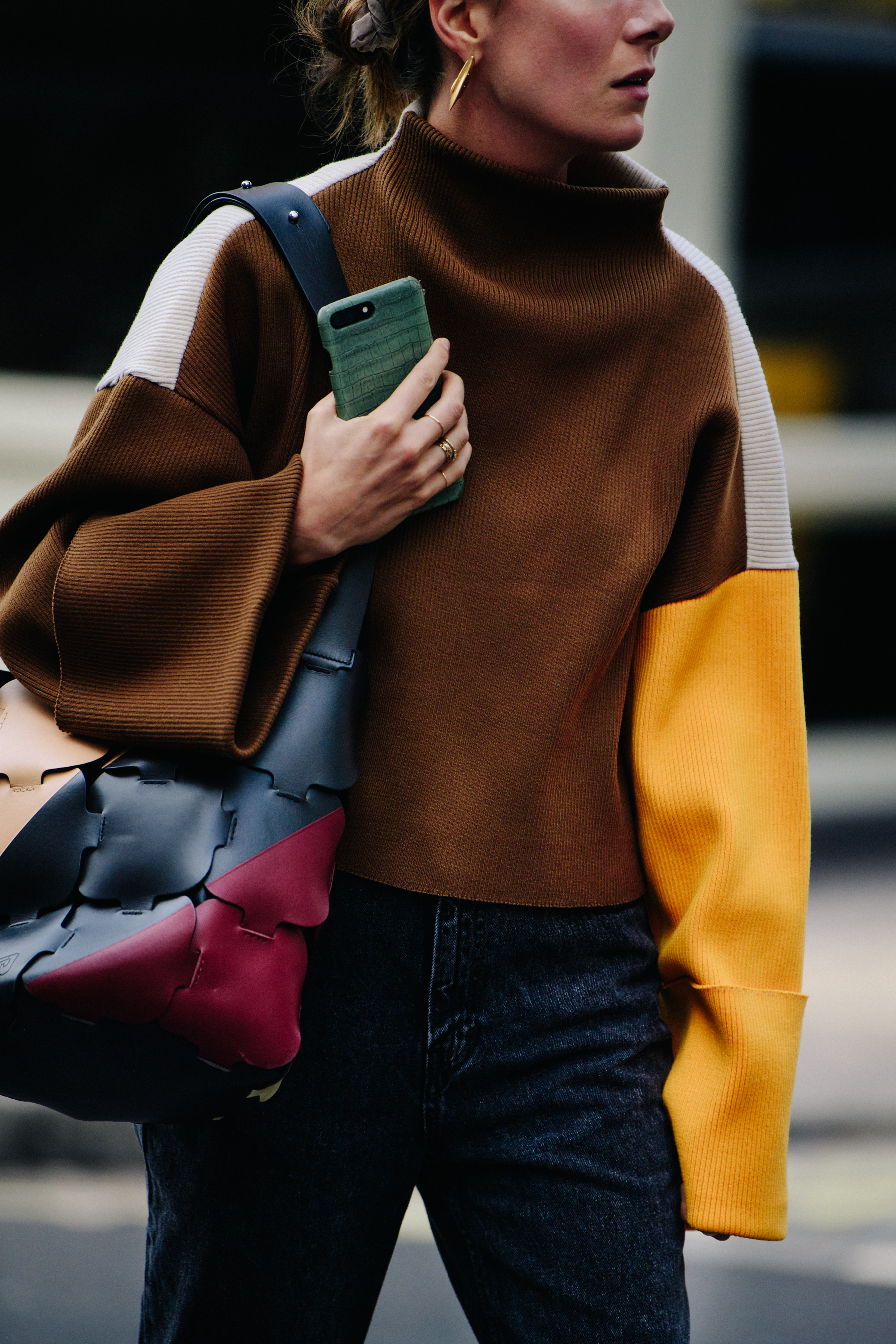 Woman wearing colourful jumper