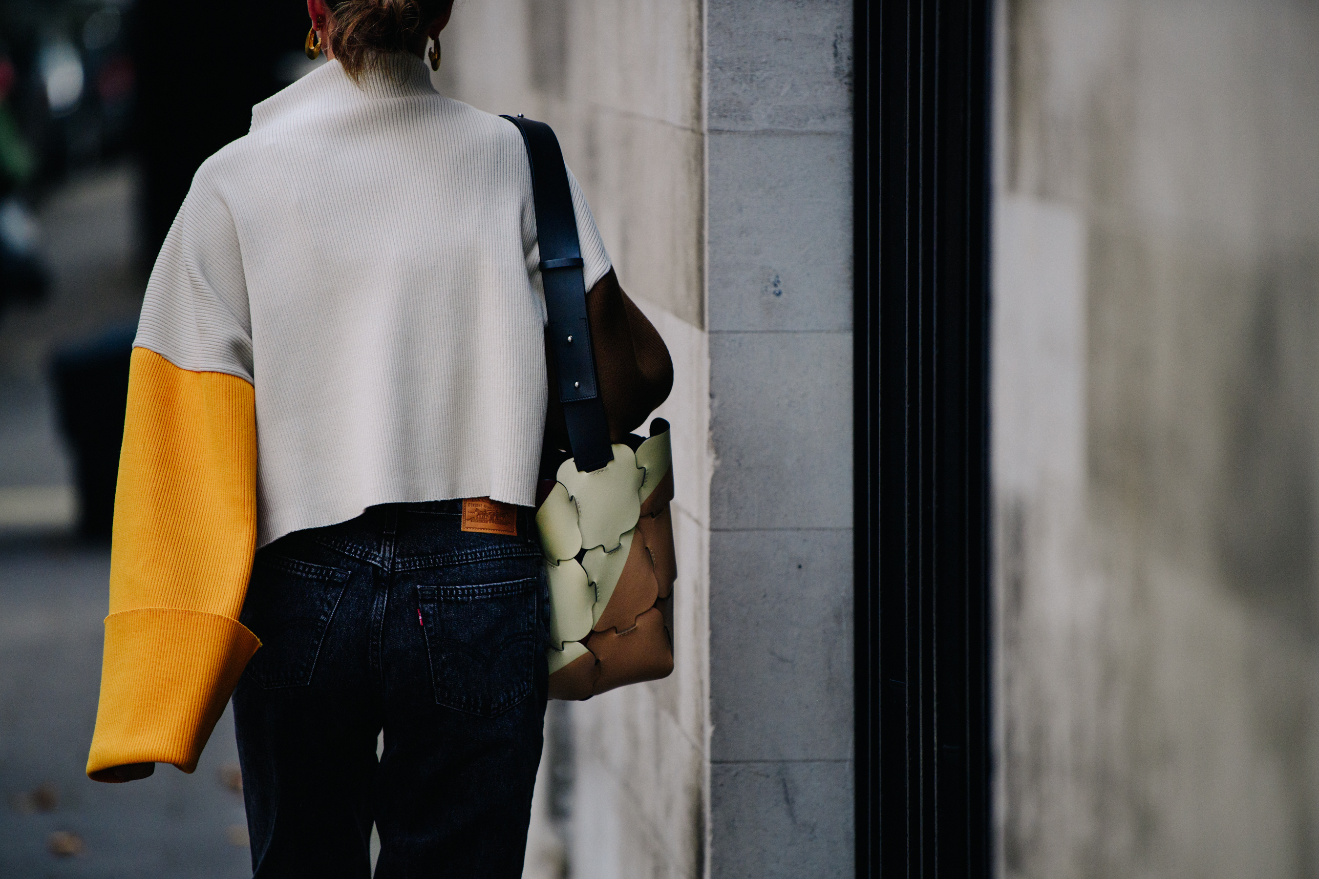 Woman wearing colourful jumper