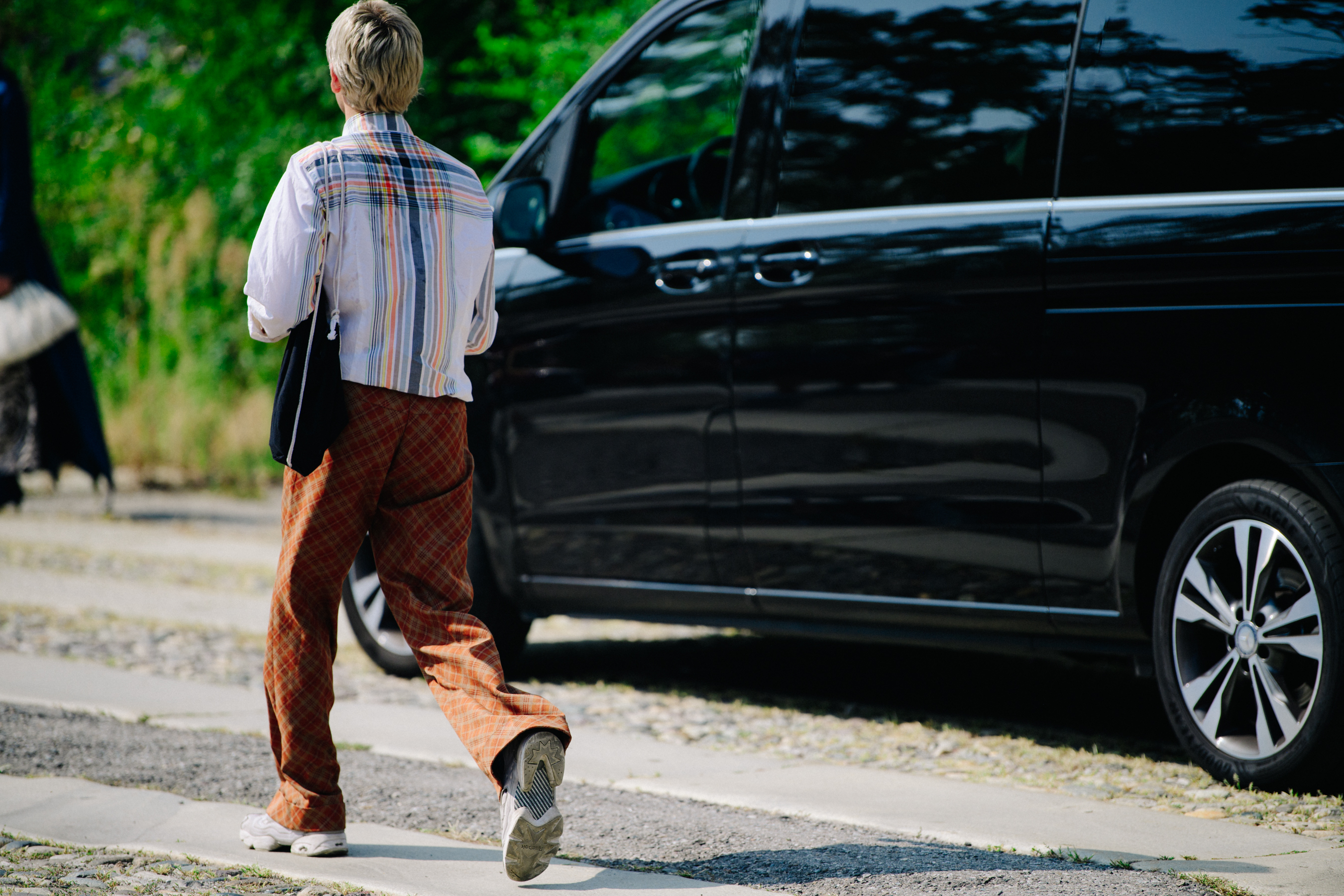 Man wearing brown check pants