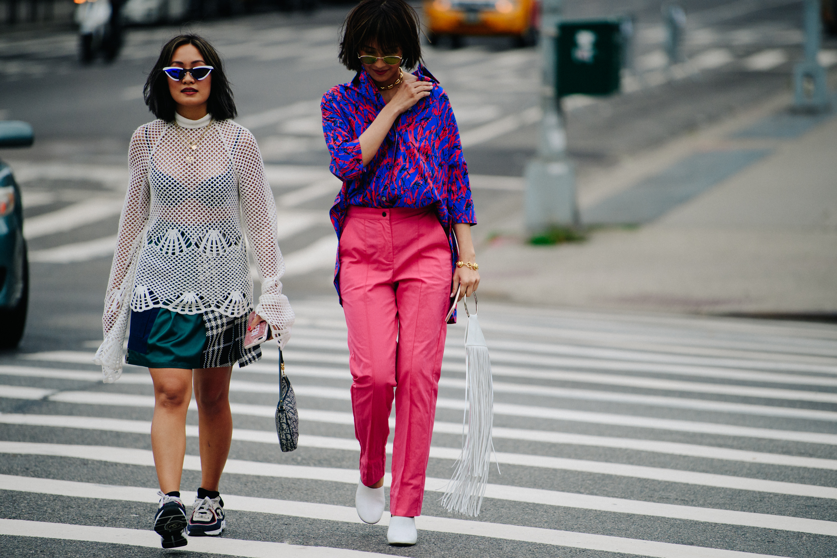 Two women wearing colourful outfits