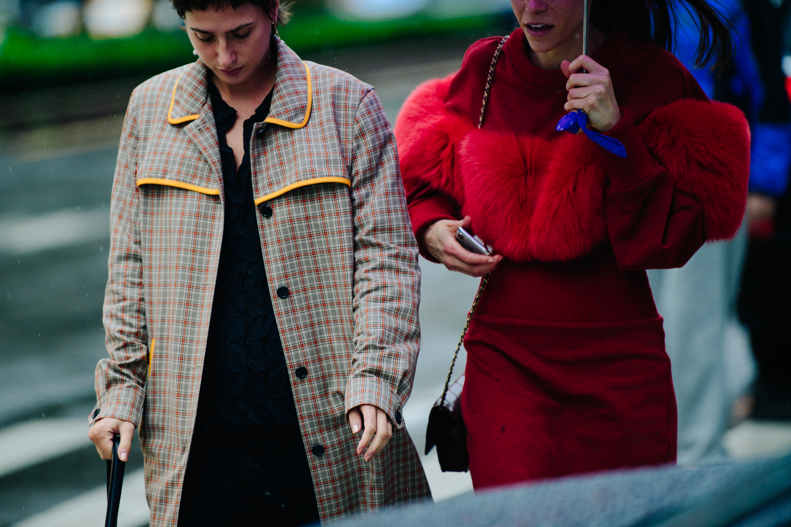 Two women wearing red coats