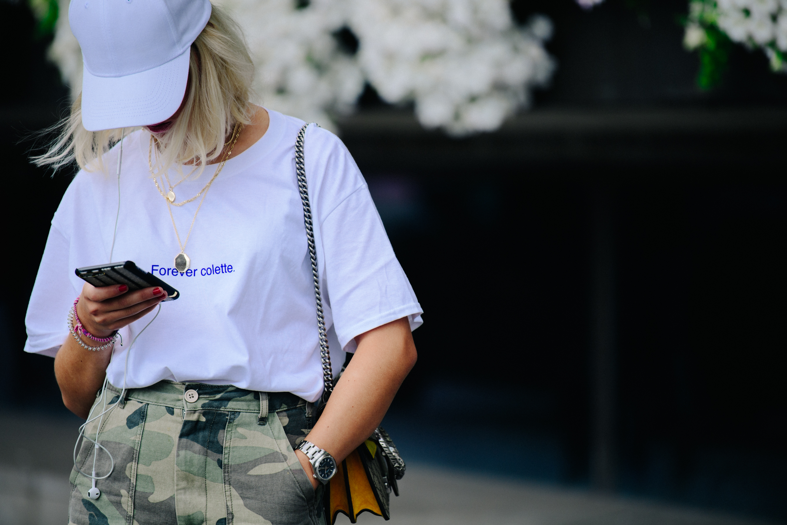 Woman wearing white cap and shirt