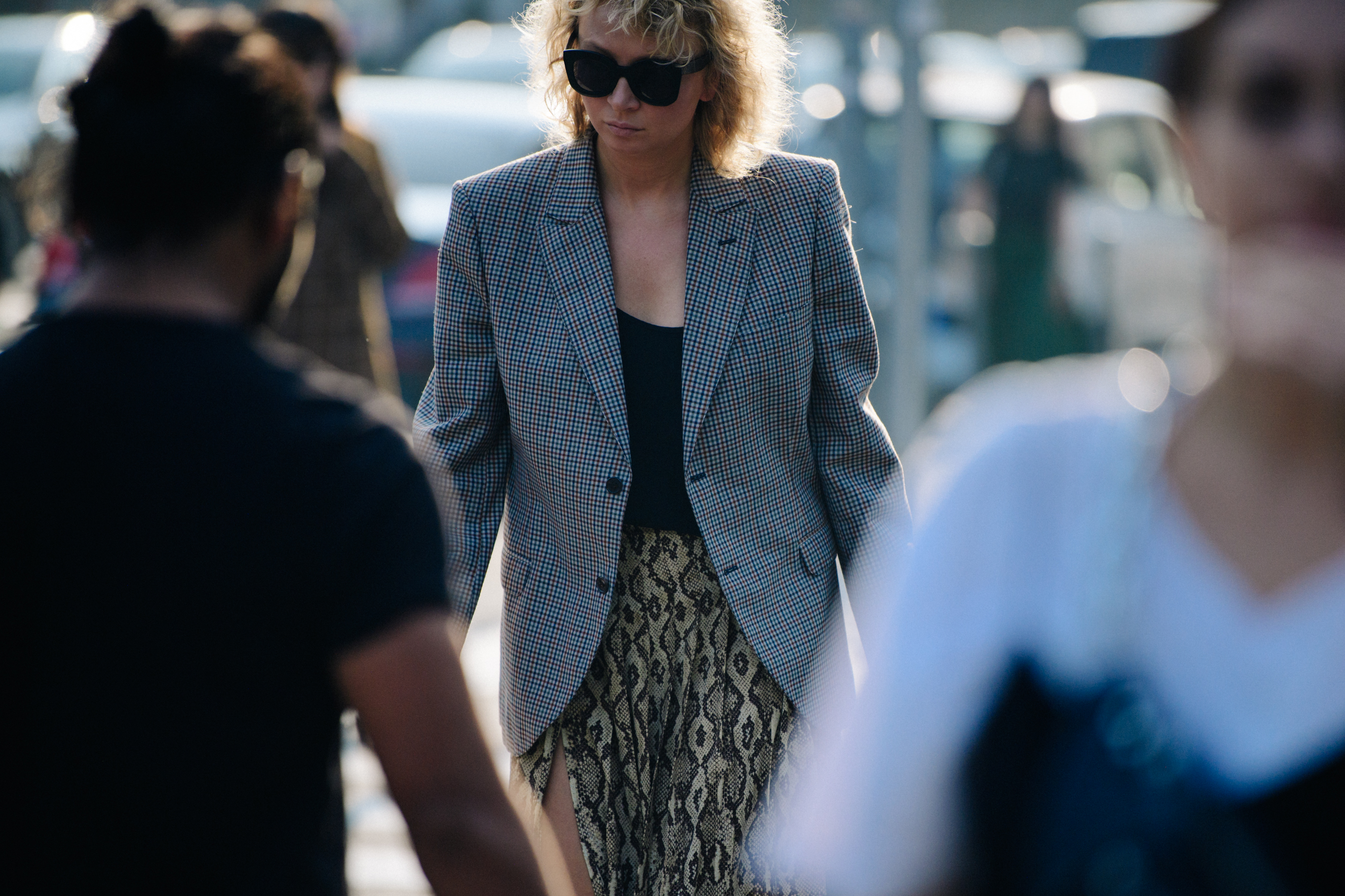 Woman wearing grey check blazer
