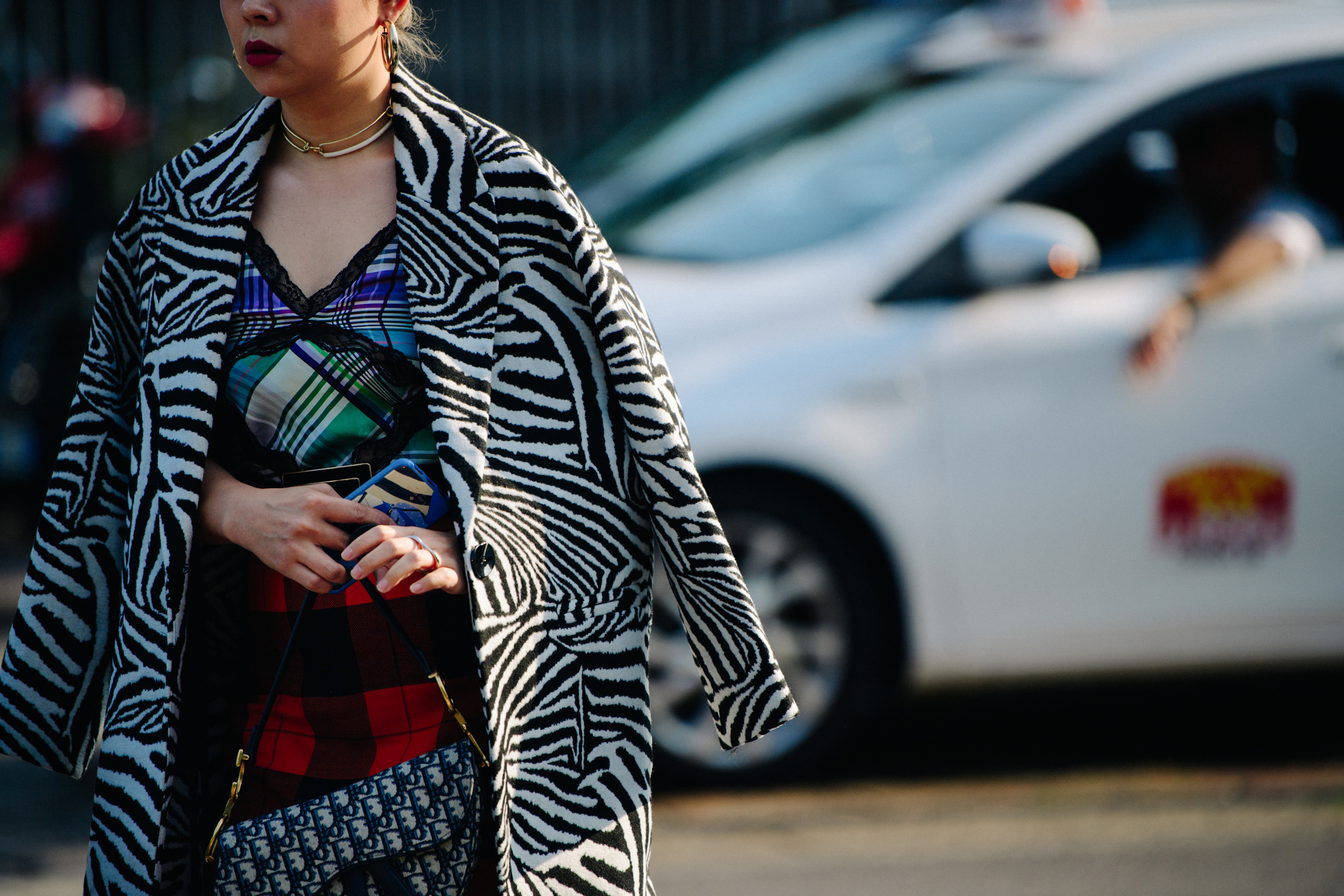 Woman wearing Zebra print coat