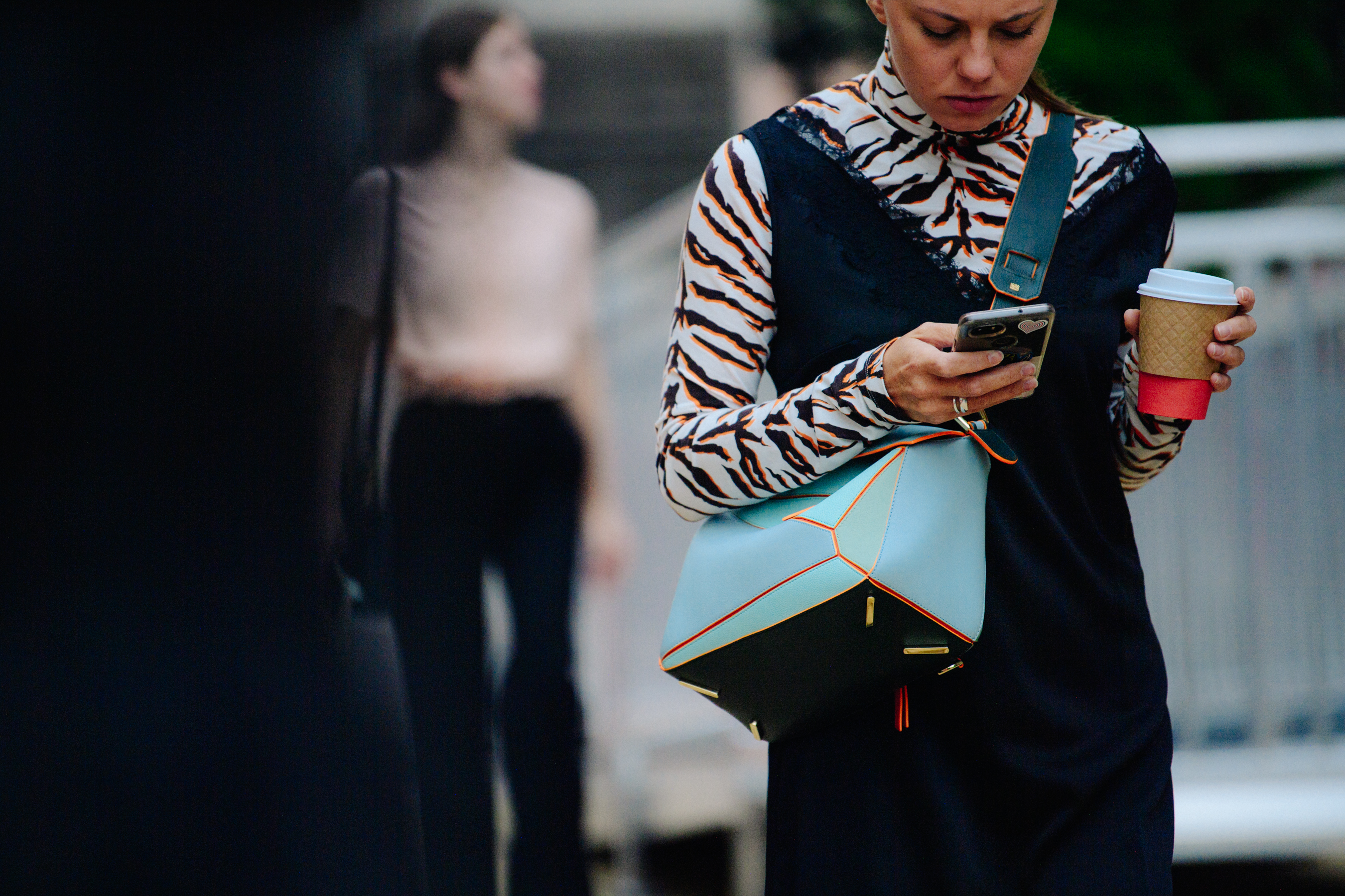 Woman carrying blue bag