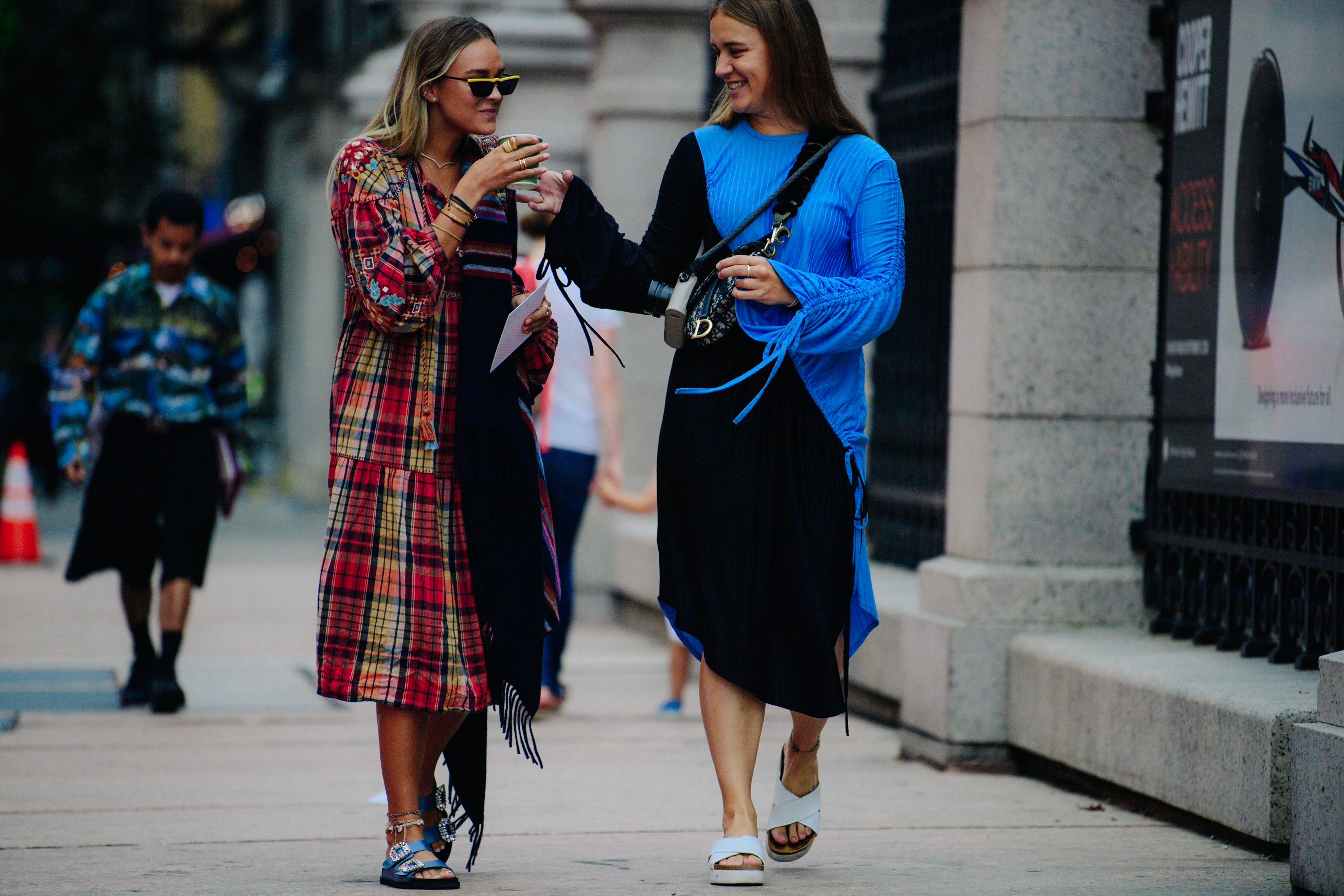 Two women wearing red and blue