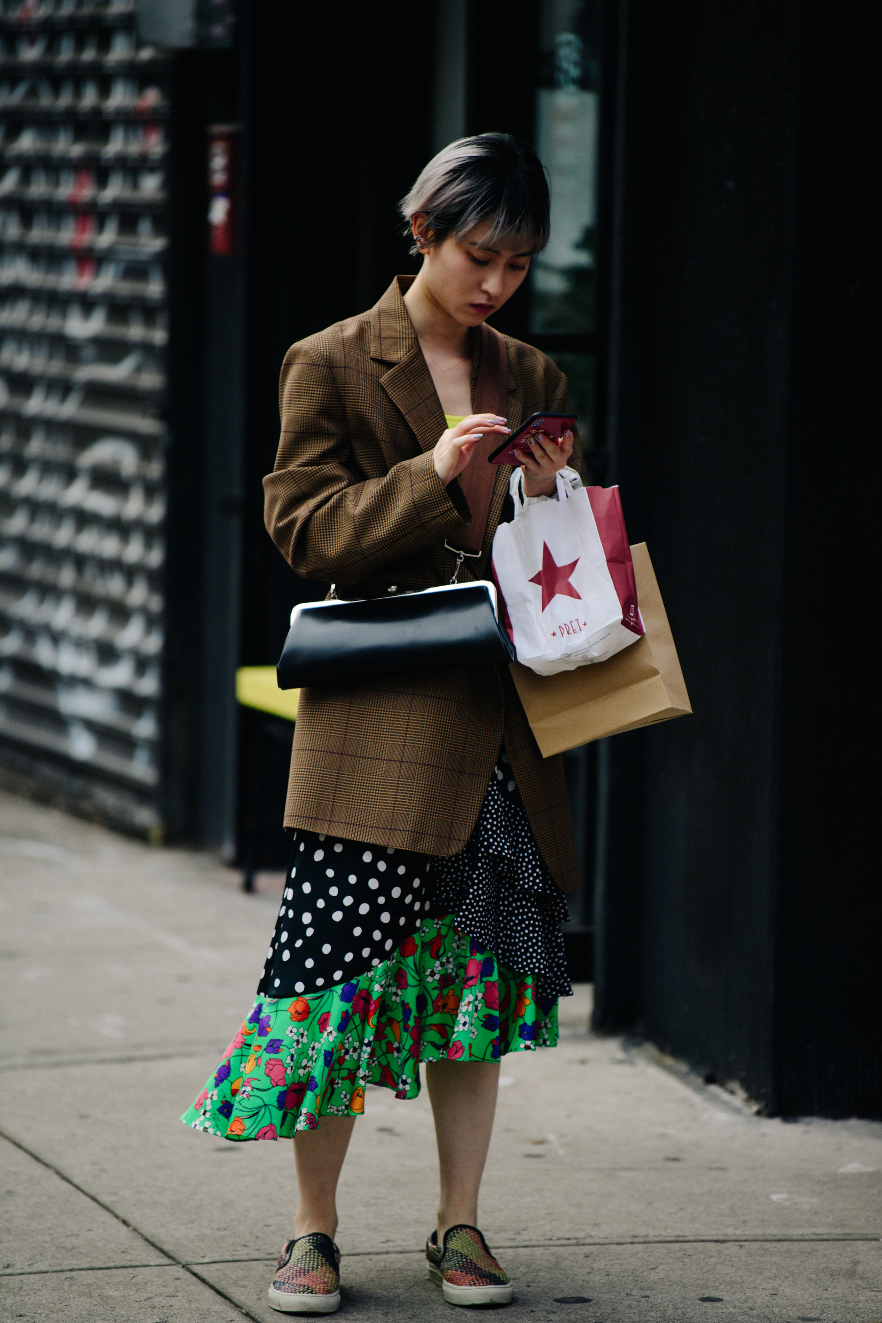 Woman wearing brown check jacket