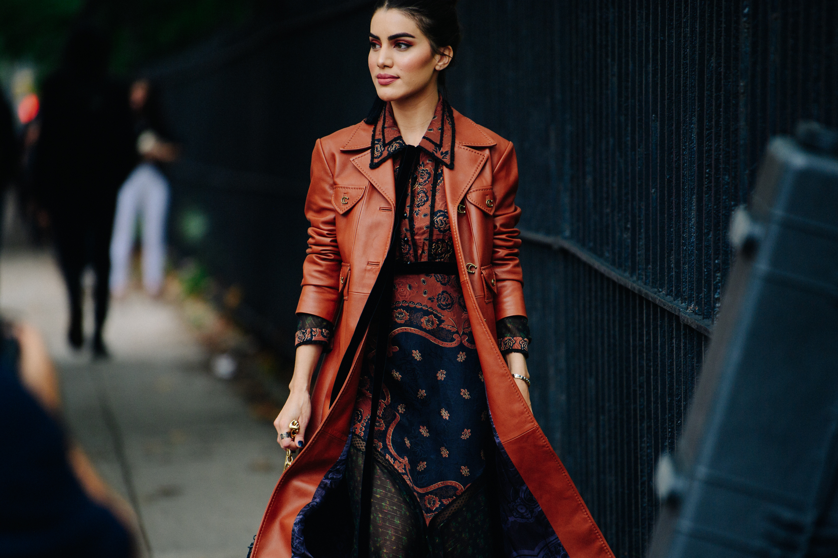Woman wearing long red leather coat