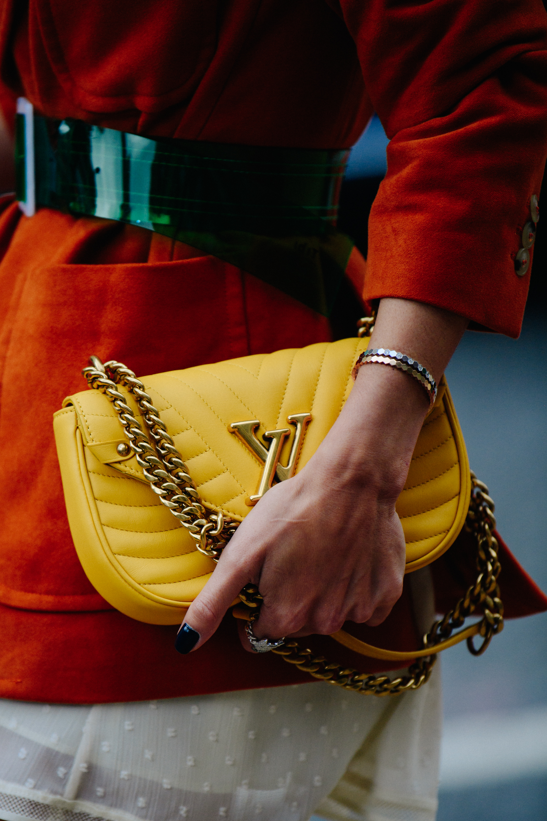 Woman carrying yellow Louis Vuitton bag