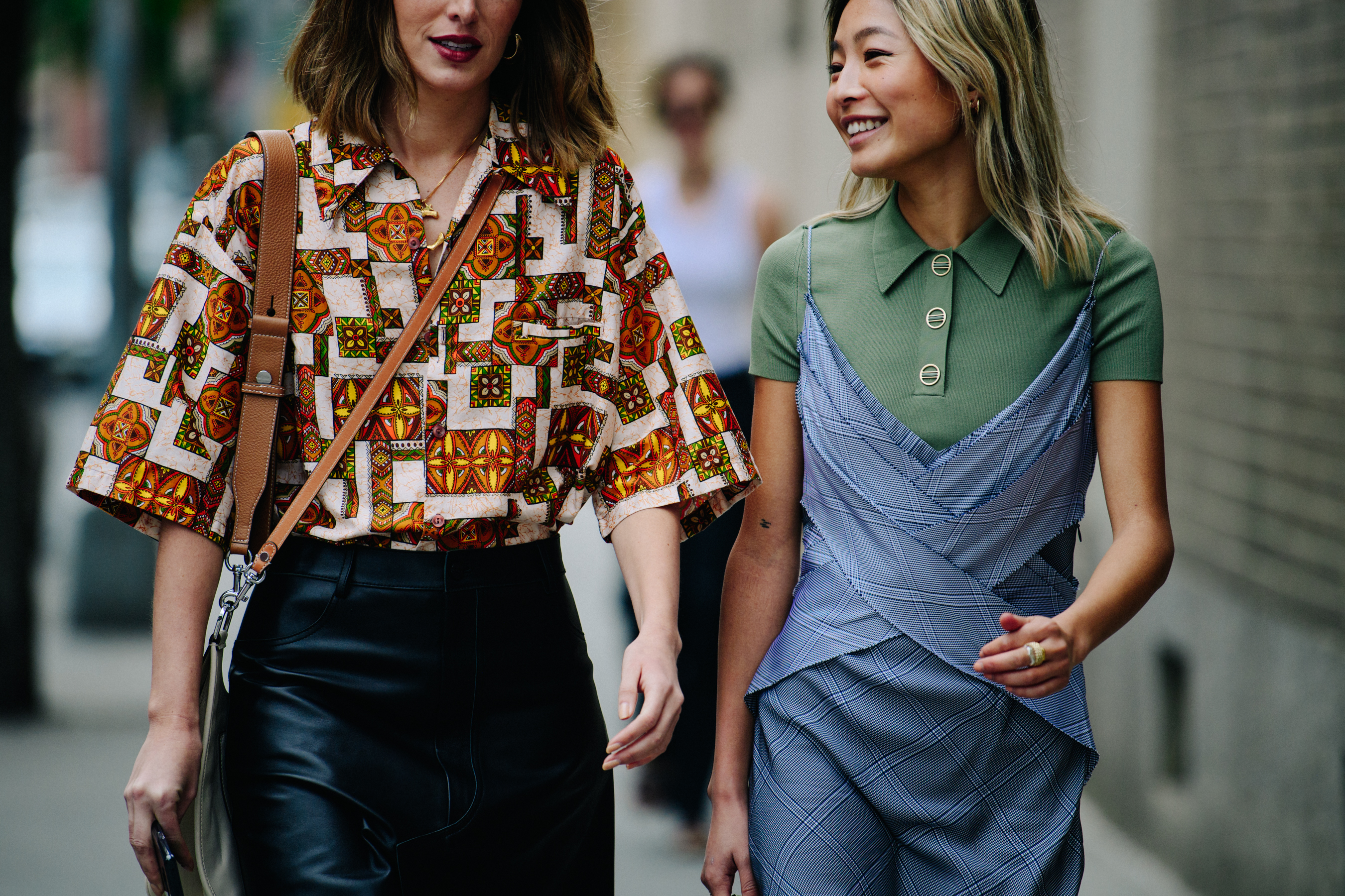 Two women wearing pattern outfits