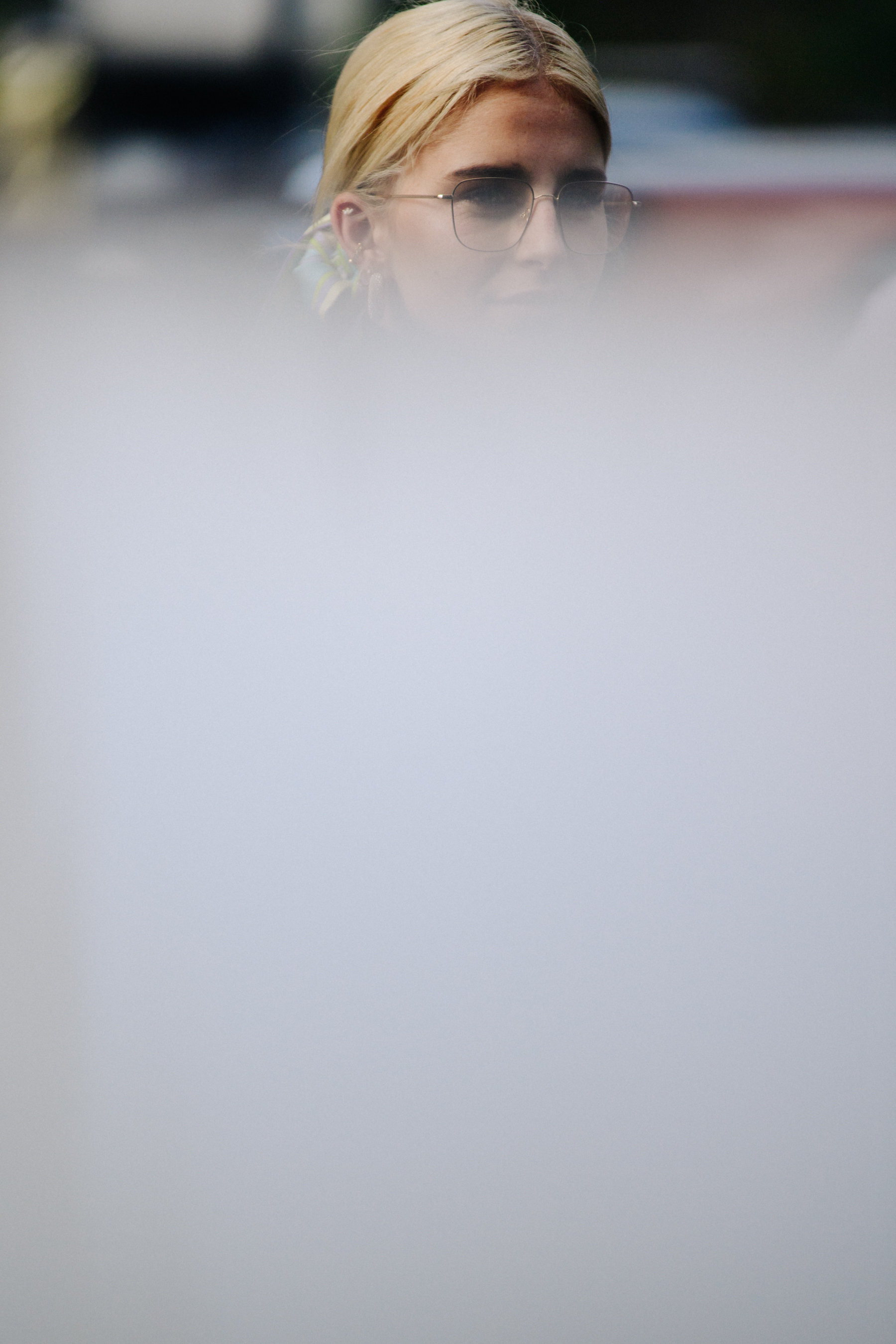 German blogger wearing clear glasses
