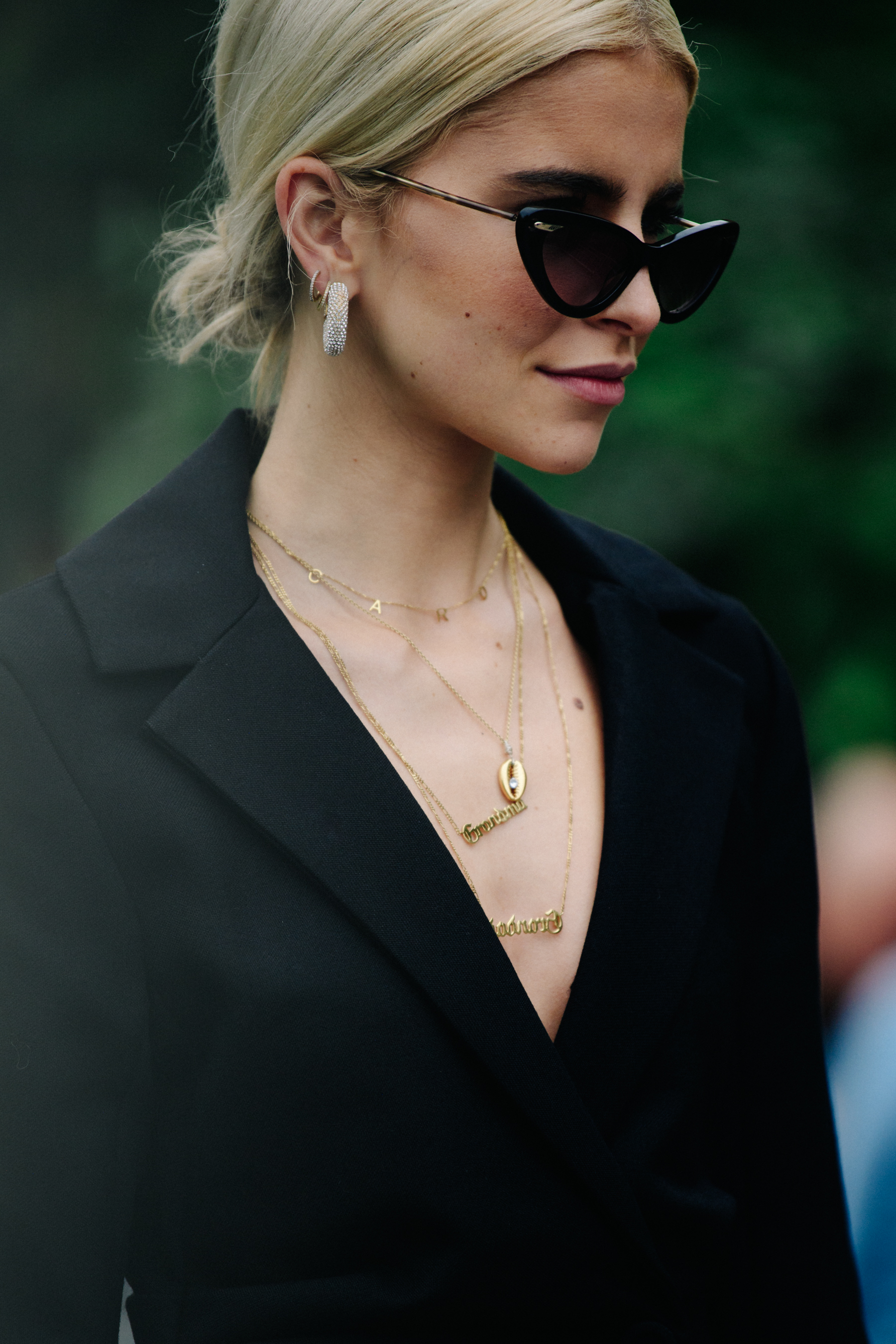German blogger wearing black suit
