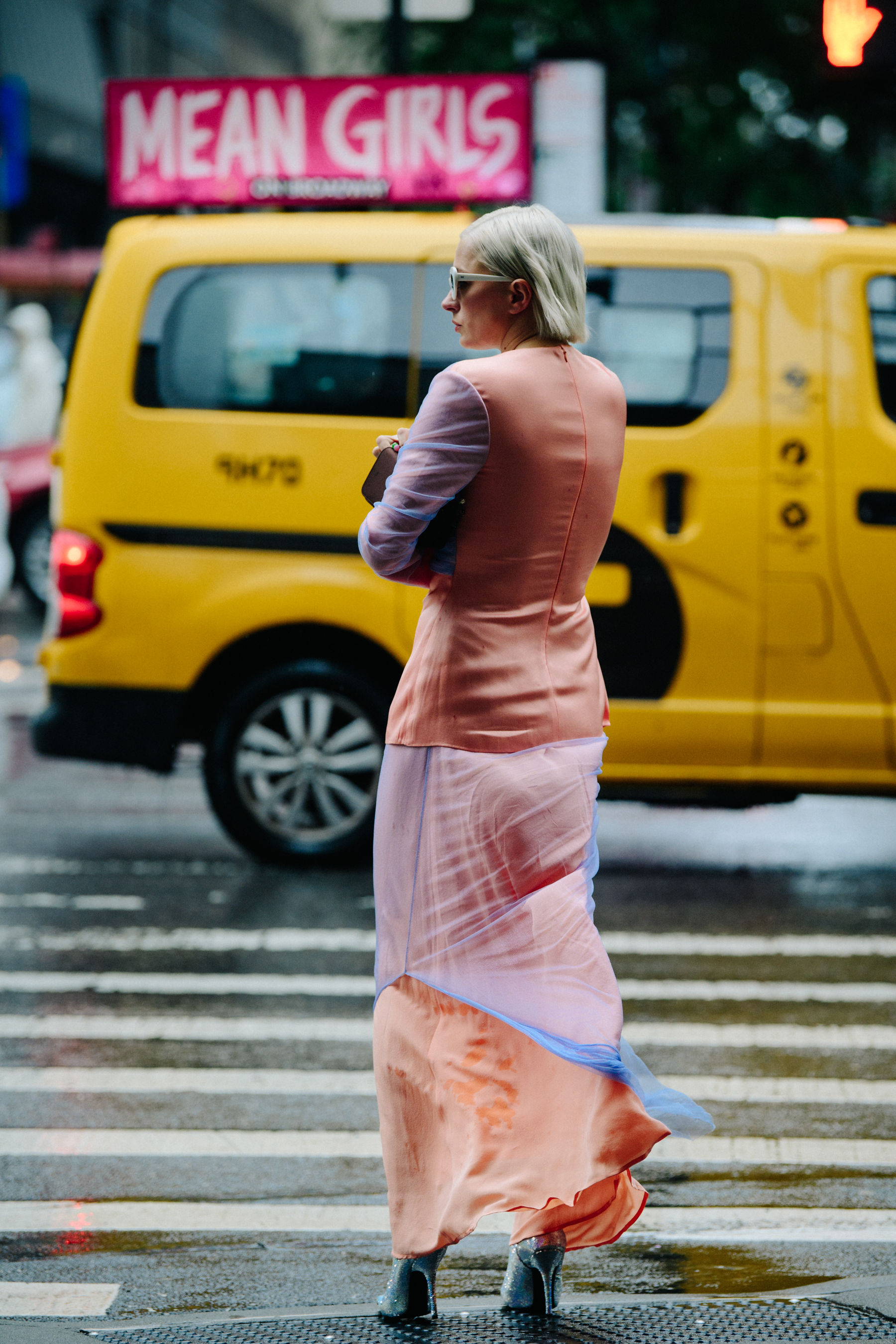Woman wearing orange and blue dress