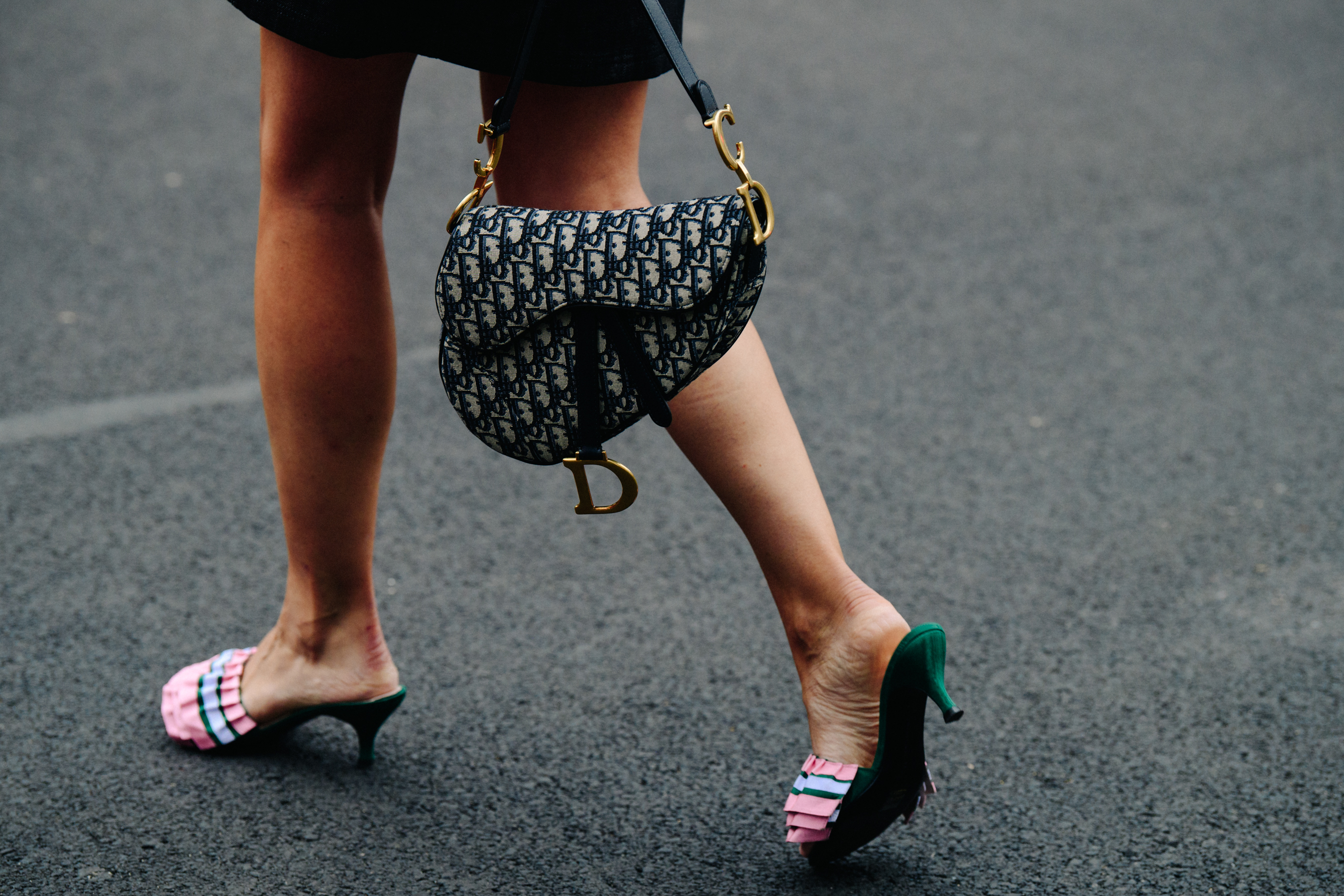 Woman carrying Dior bag