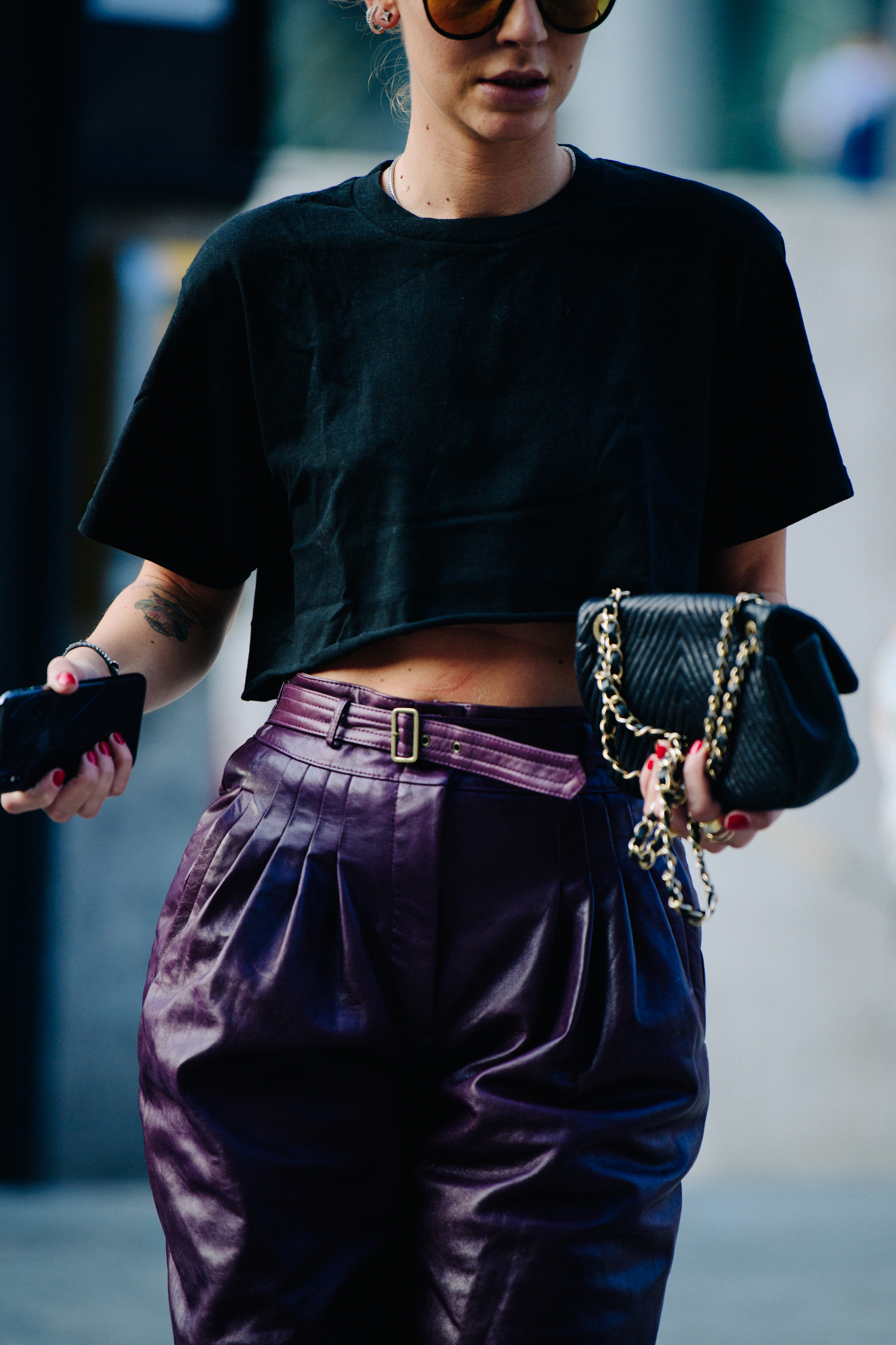 Woman wearing purple leather pants