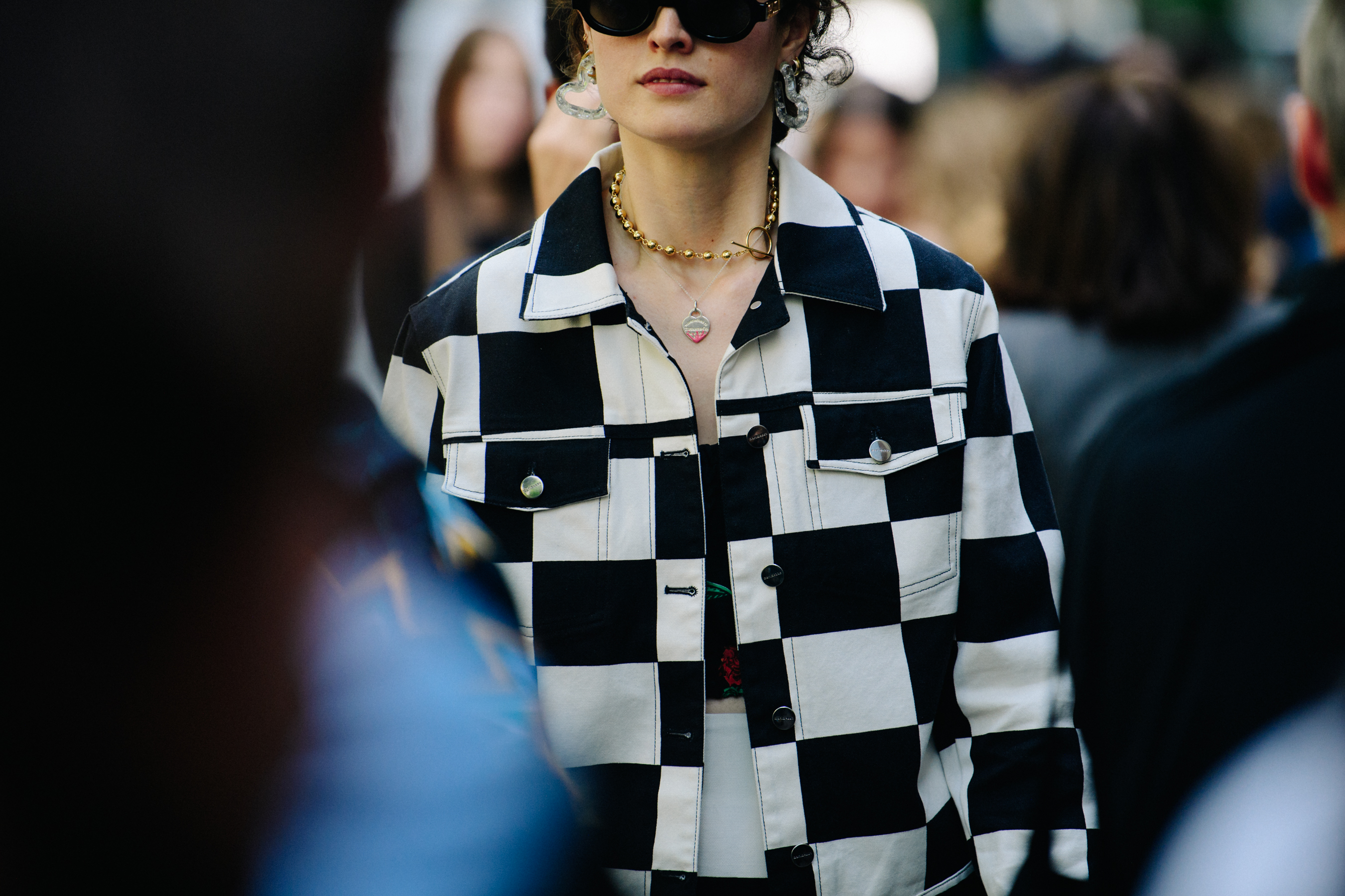 Woman wearing checkerbaord jacket