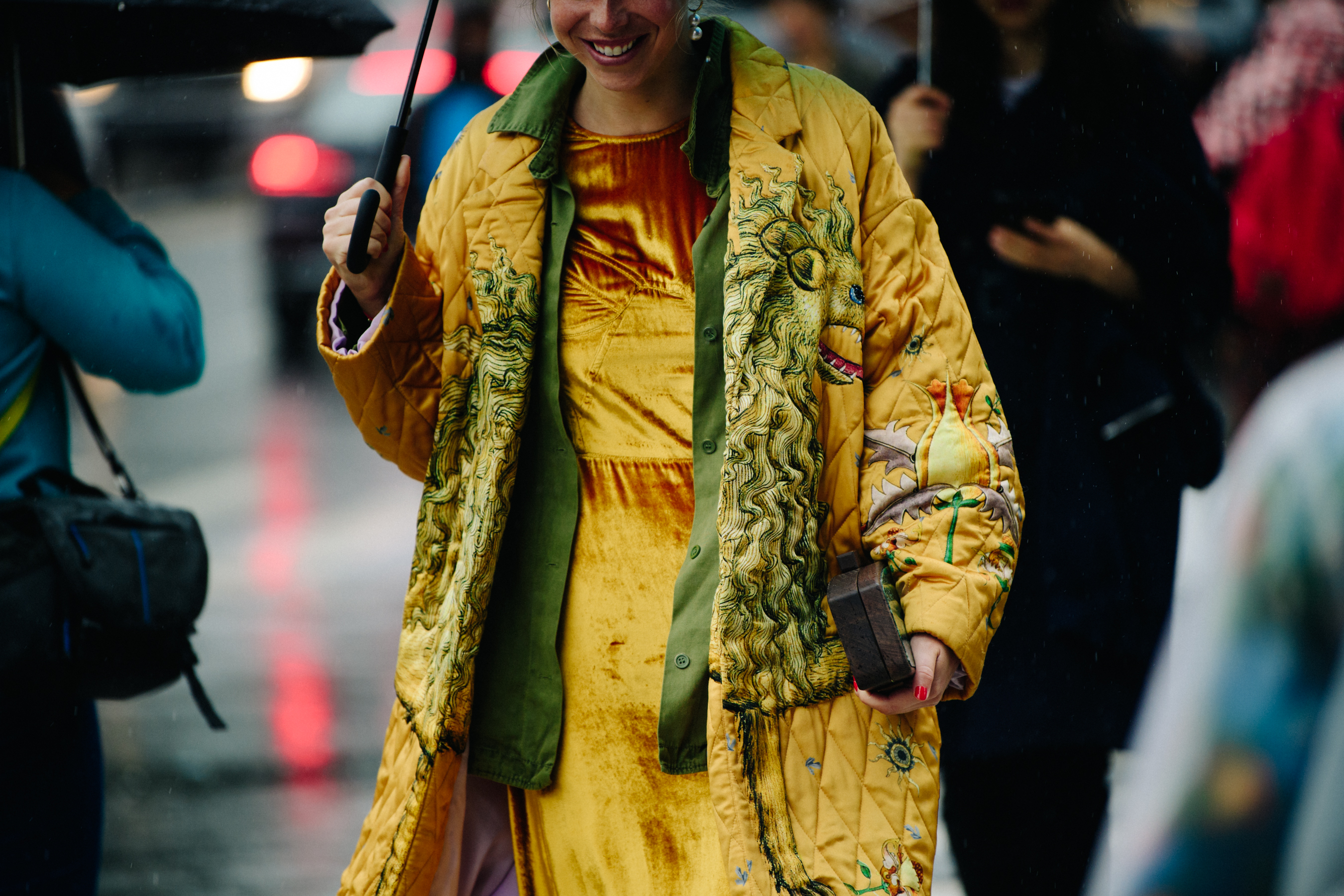 Woman wearing golden coat