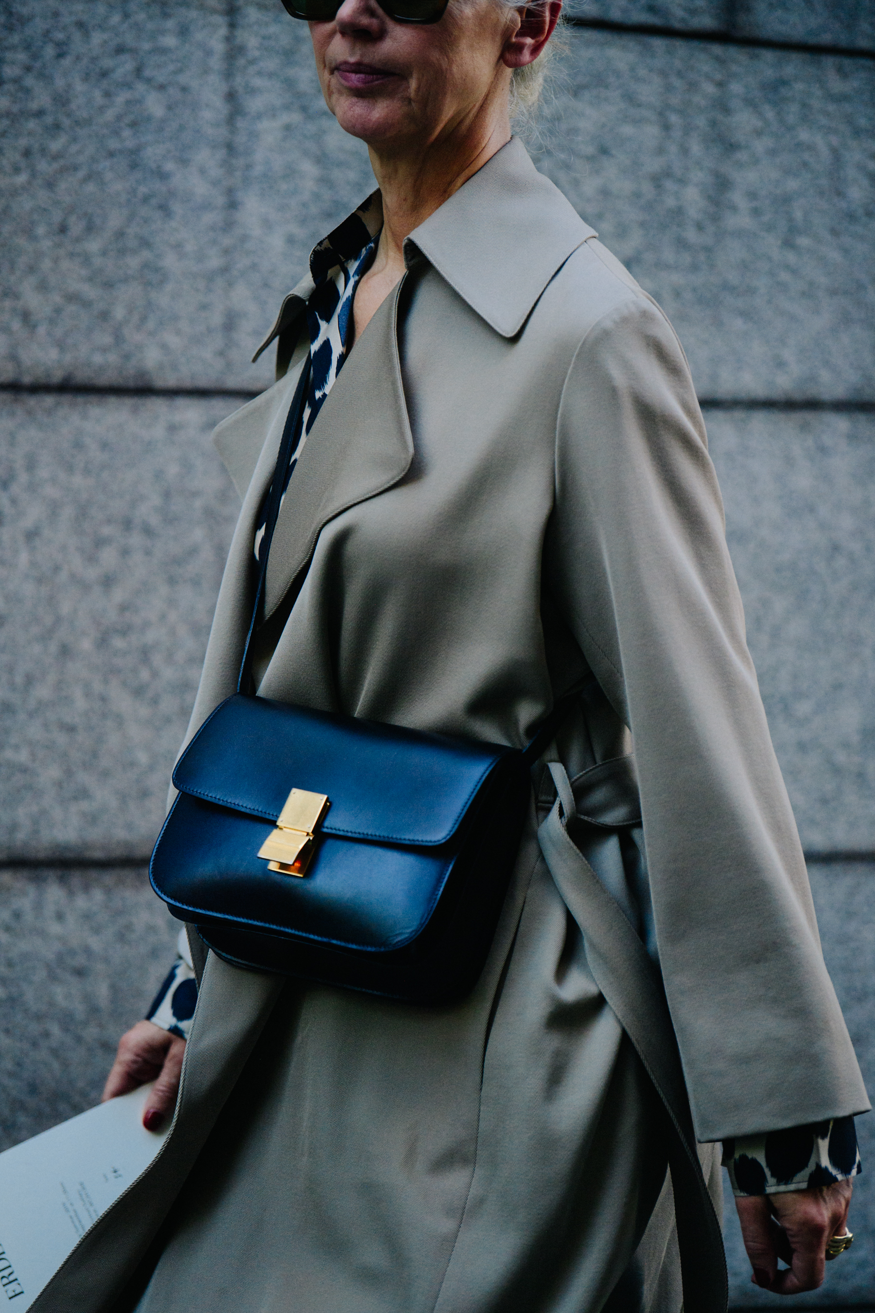 Woman wearing black leather bag
