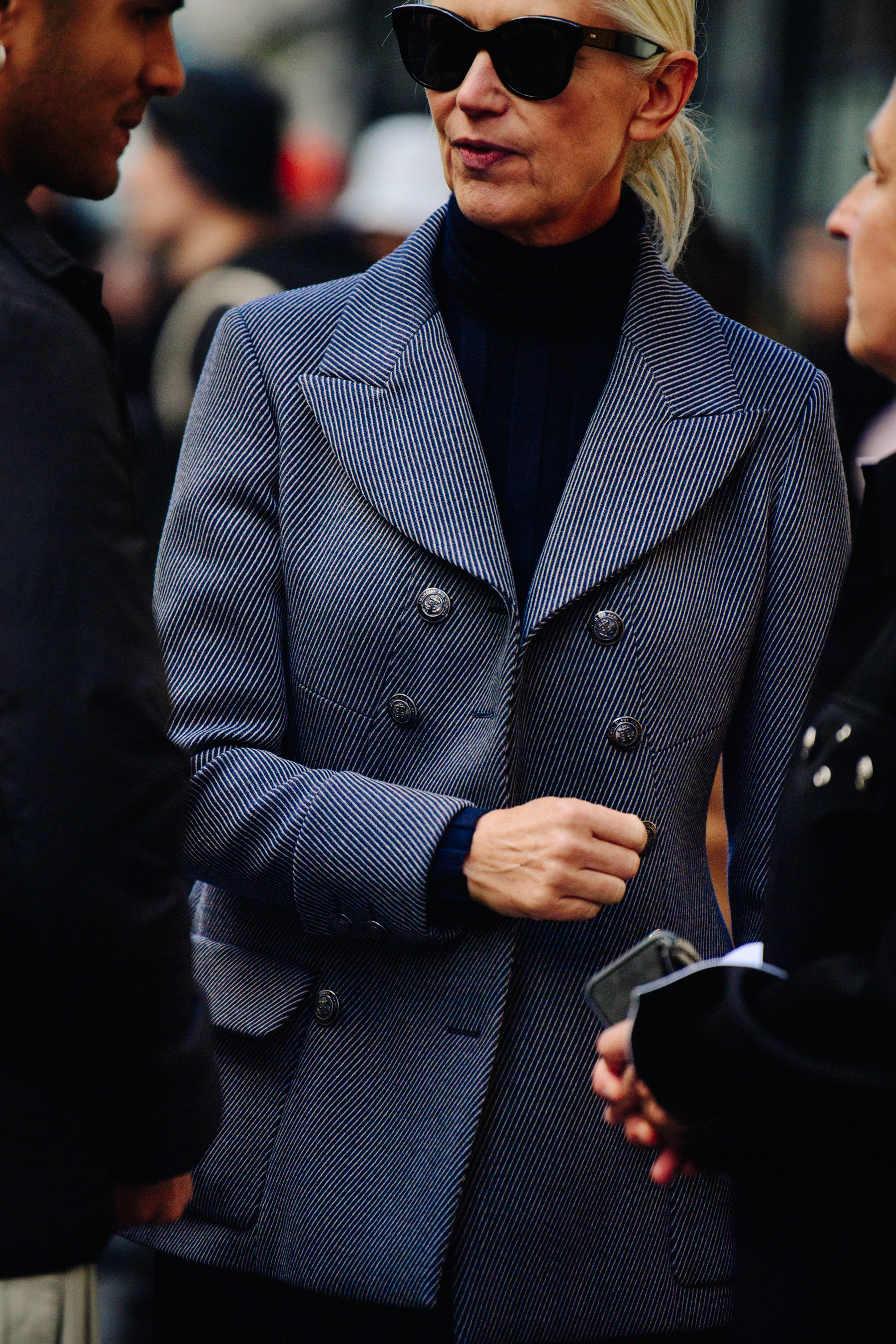 Editor wearing striped Navy jacket