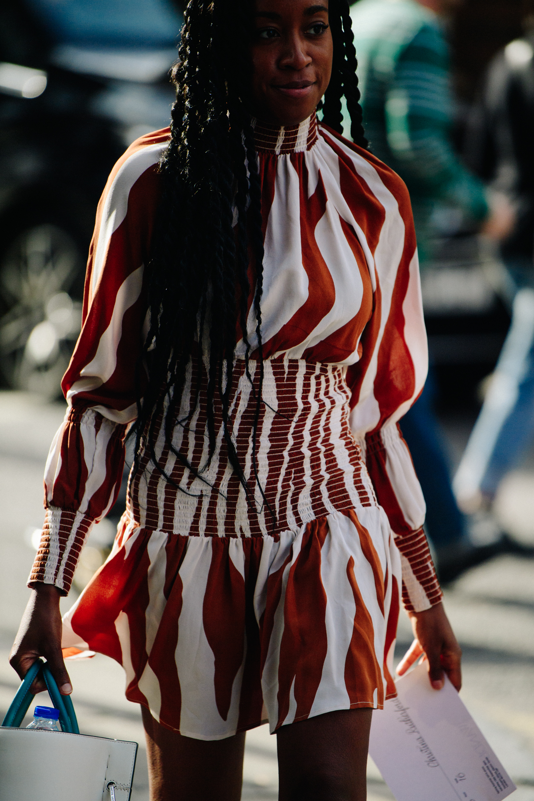 Woman wearing brown striped dress