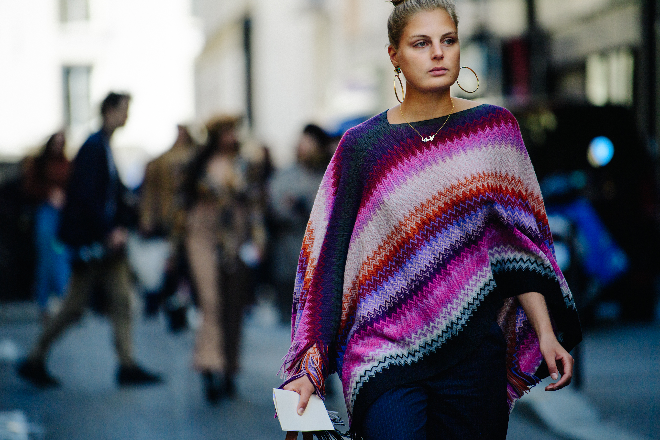 Woman wearing purple poncho